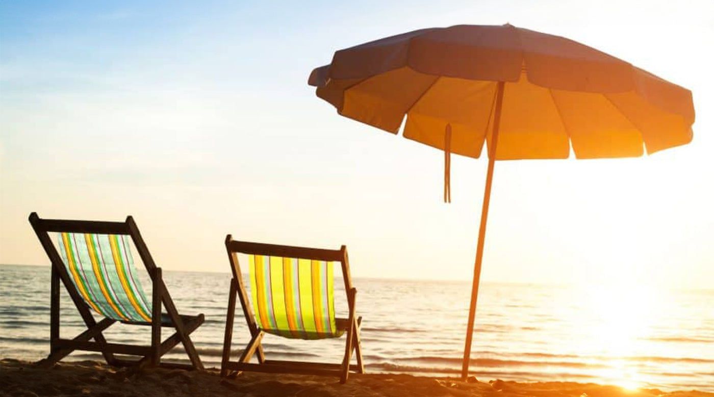 Parasol and beach chairs on the coast