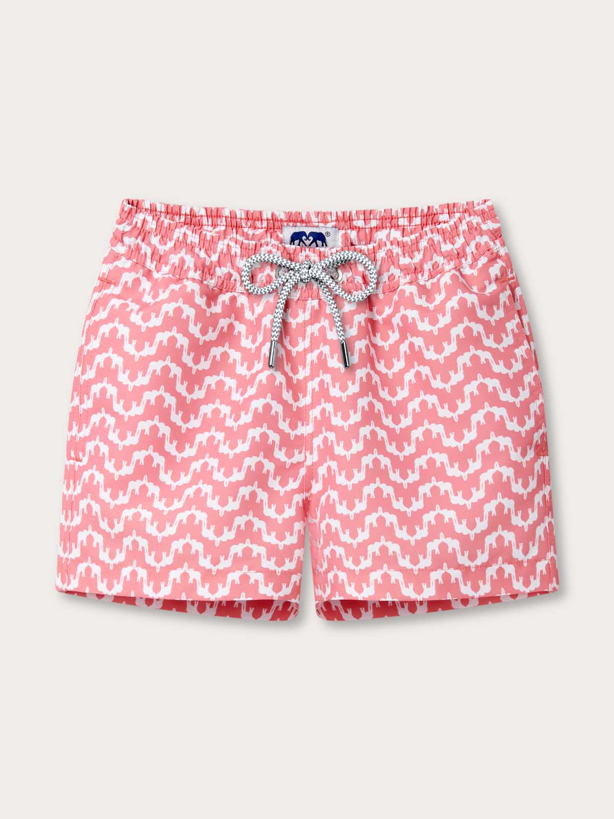 Boys Elephant Palace Strawberry Staniel Swim Shorts by Love Brand & Co. Front view of white and pink swimming shorts for kids with drawstring waist and front pockets.