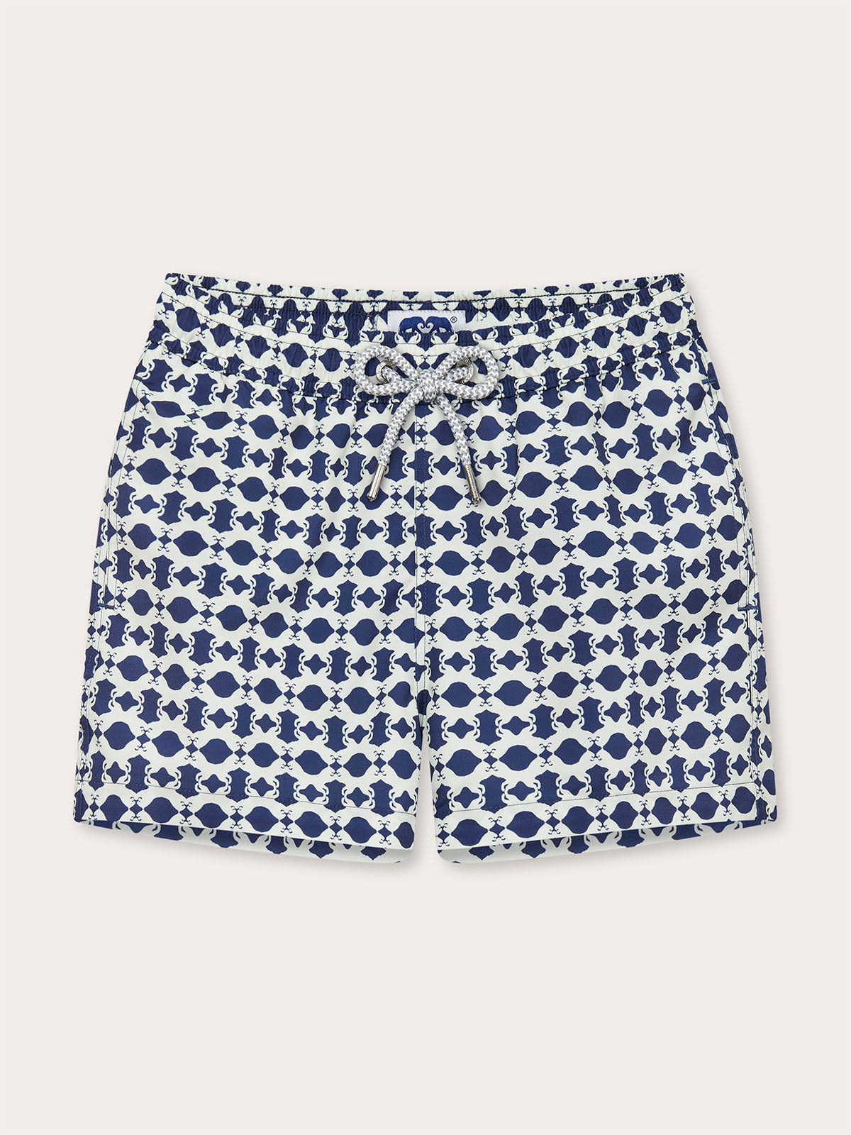 Front view of Boys Eye of the Tiger Staniel Swim Shorts featuring a unique geometric print in vintage tones of stone and Chambray Blue. Swim shorts kids.