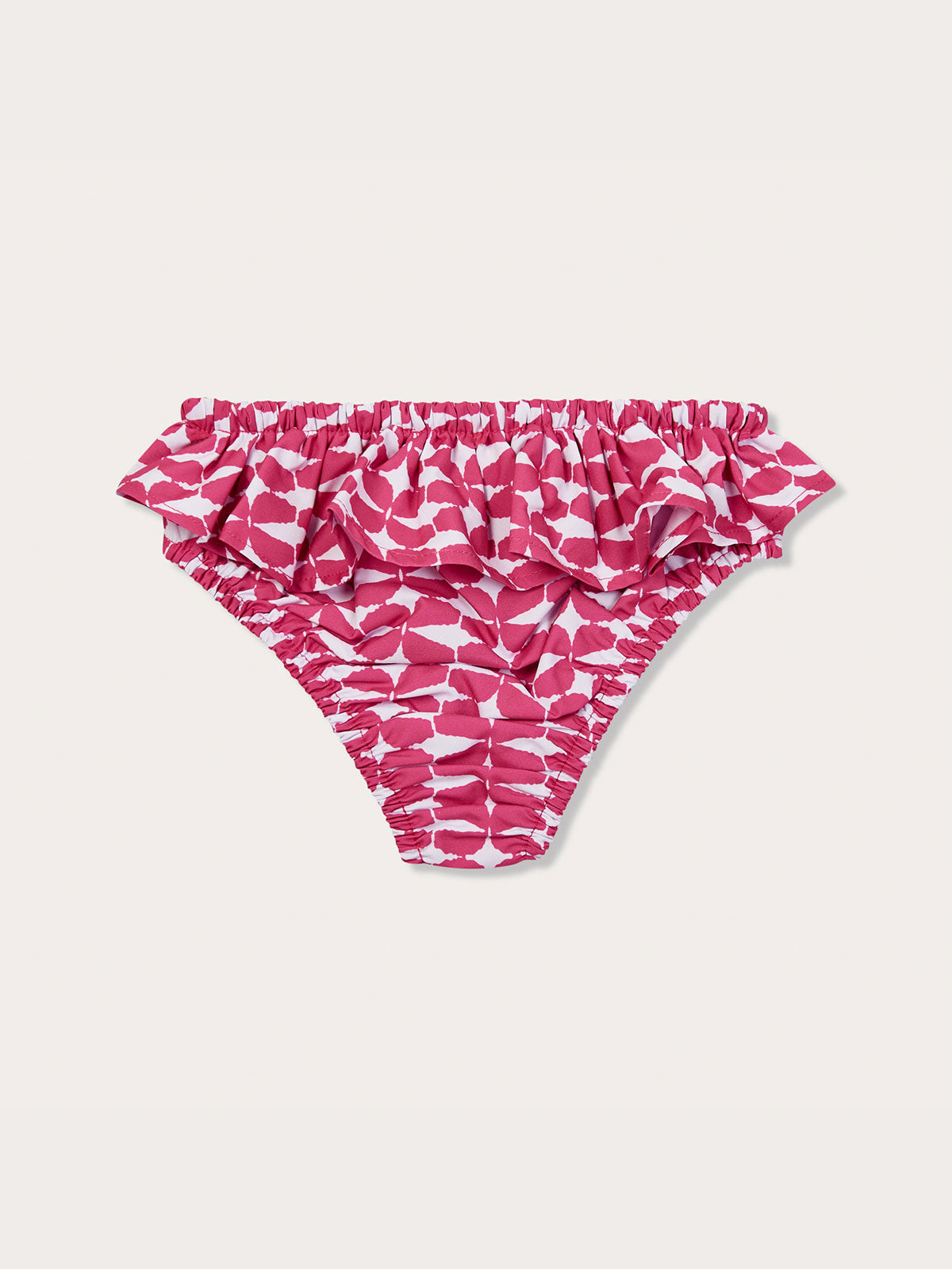 Pink Girls World Is Your Oyster Calabash Bottoms with ruffled waist and white leaf pattern.