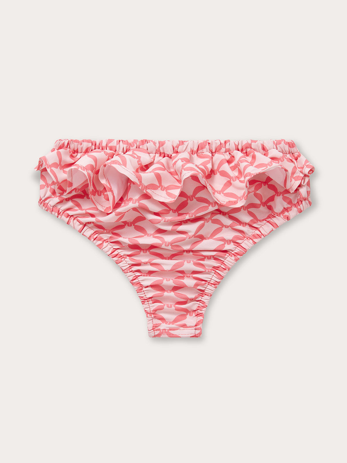 Light pink and watermelon geometric diamond print baby swim bottoms featuring a ruffled waistband.