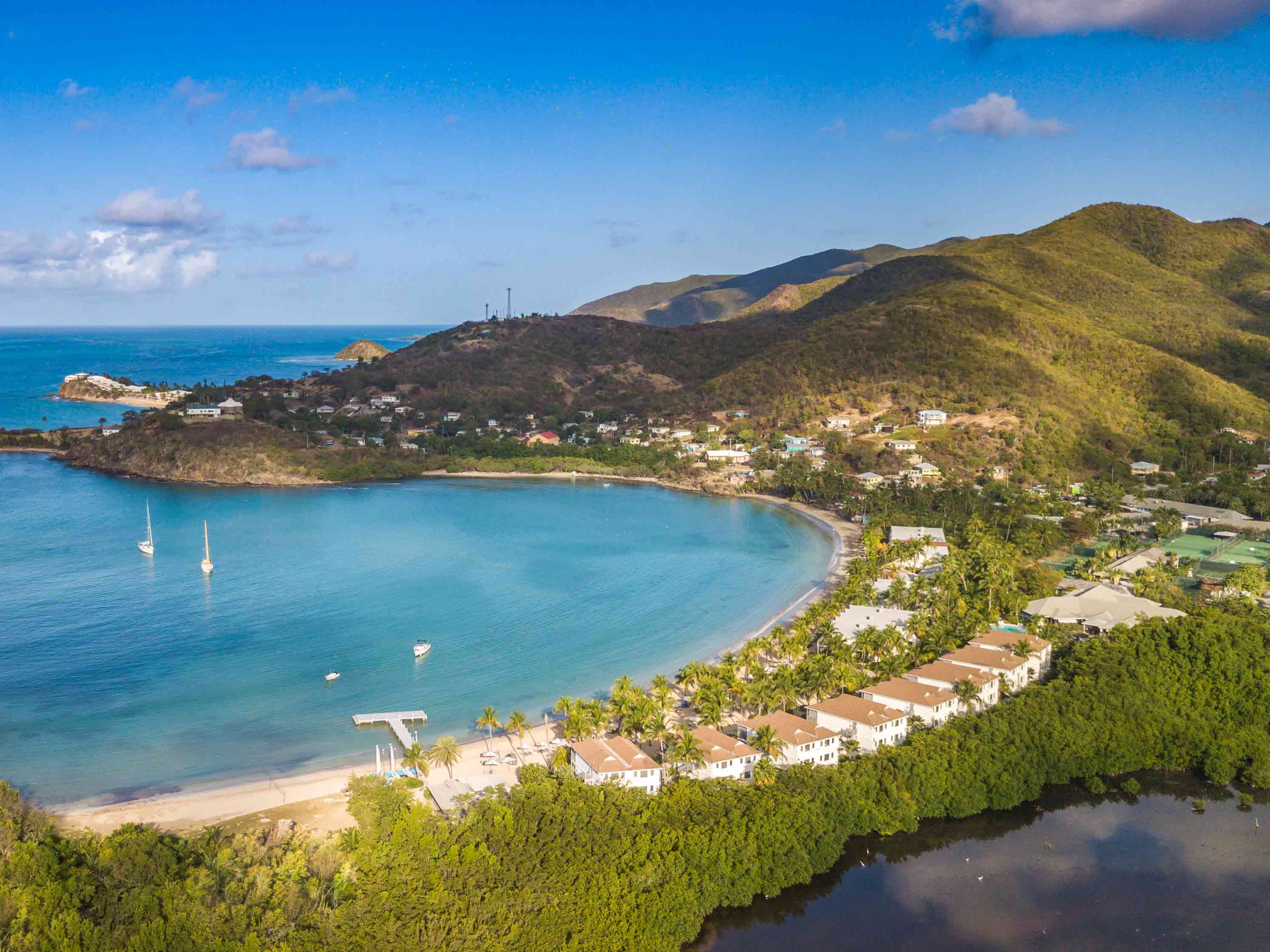 Aerial view of Carlisle Bay showing the resort, beach and turquoise waters.