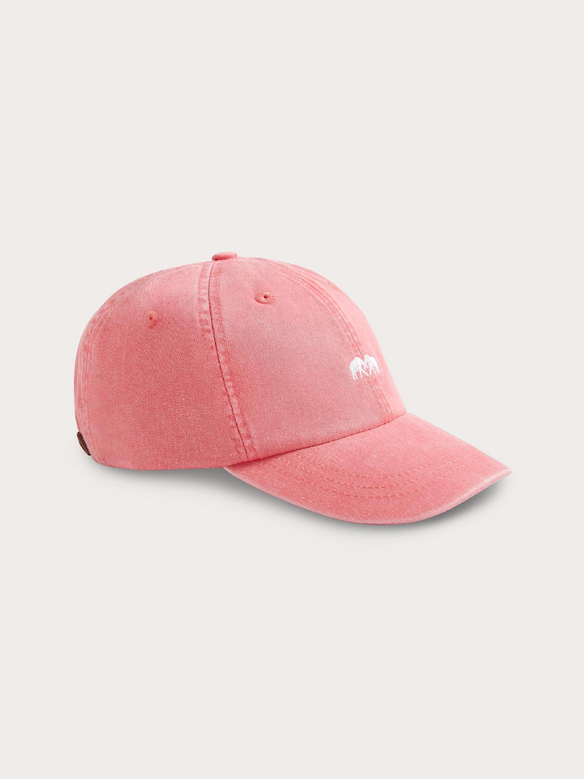 Pink baseball cap with a small logo on a light grey background