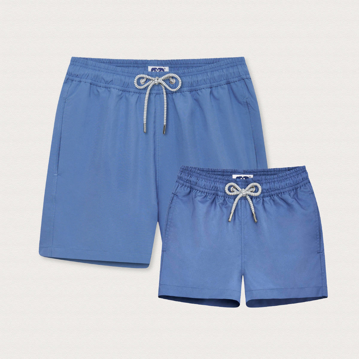 Two pairs of deep blue swim shorts