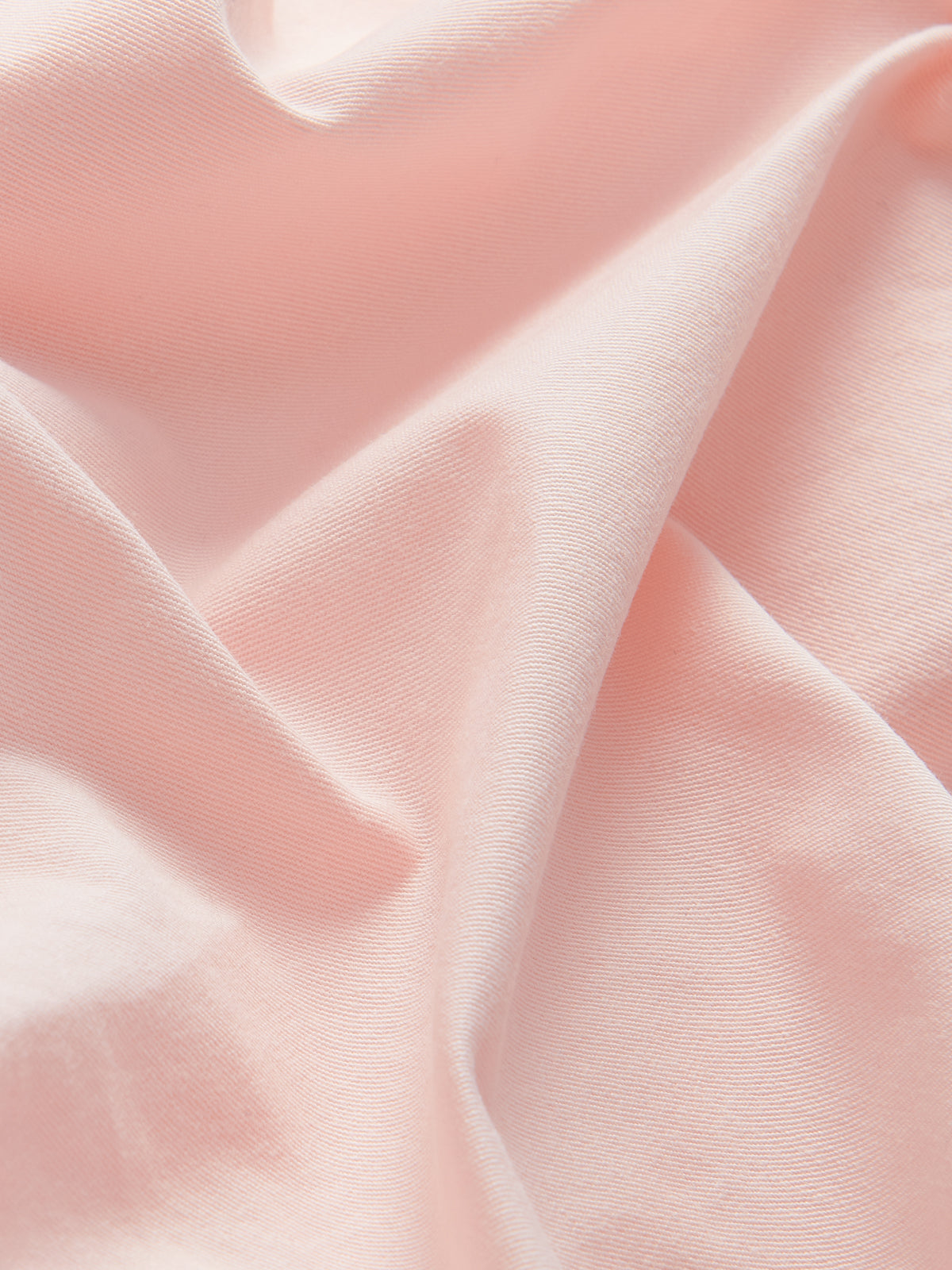 Detailed view of Men's Pastel Pink Harvey Cotton Shorts. Pastel pink 100% linen fabric.