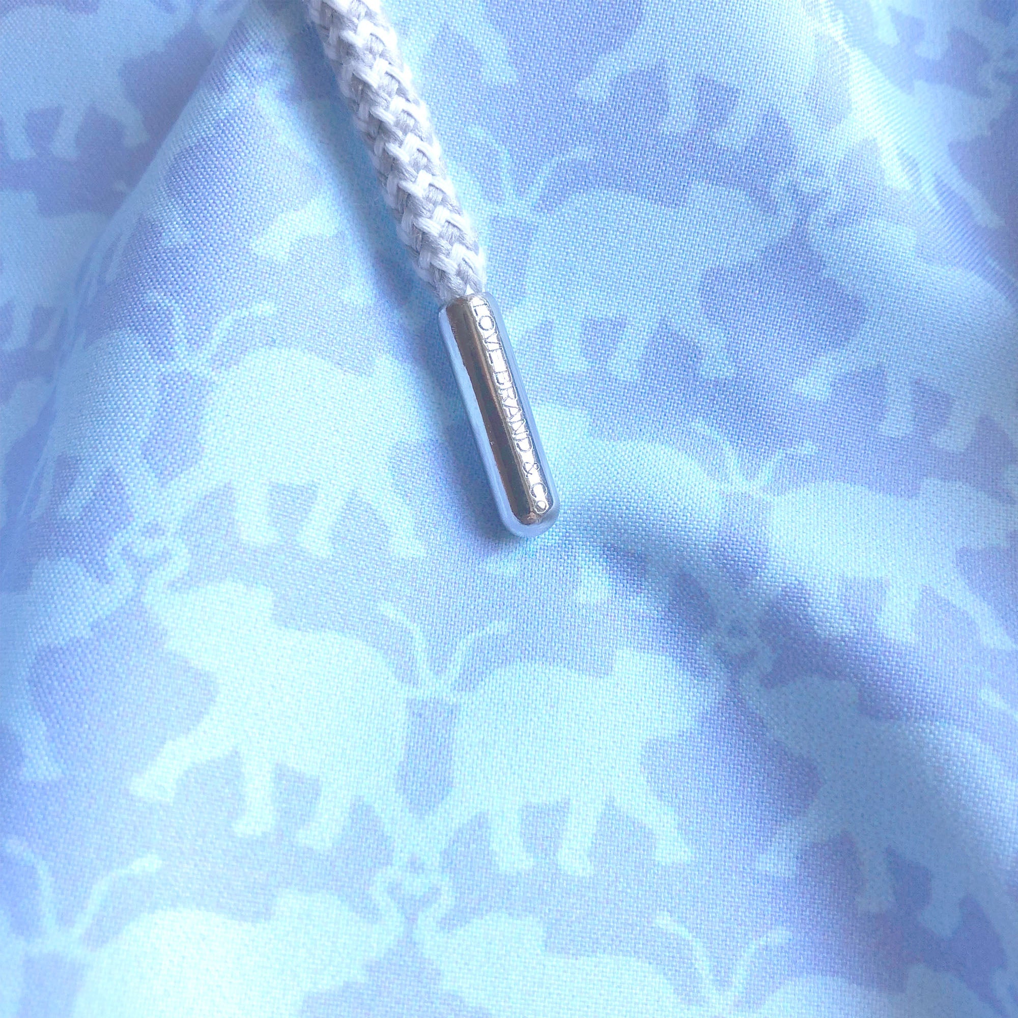 Close-up of Boys Elephant Dance Blue Staniel Swim Shorts showing detailed elephant print and drawstring.