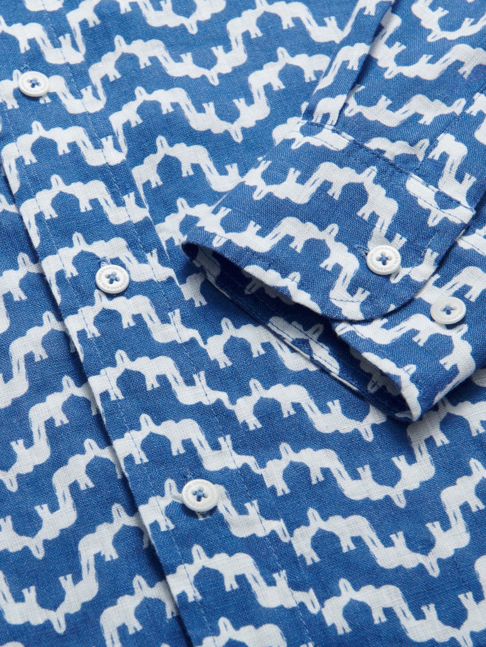 Men's Elephant Palace Blue Abaco Linen Shirt. Close-up of our bestselling blue and white elephant palace print on our mens linen shirt.