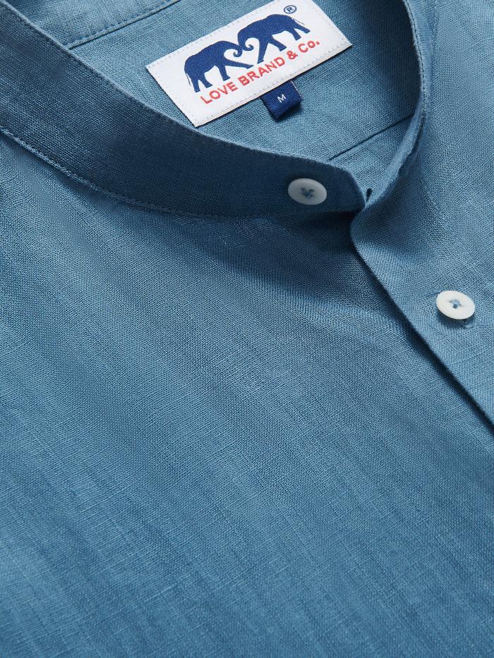 Close-up view of the Men's Elephant Palace Blue Maycock Linen Shirt showcasing the collar, buttons, and the brand label from Love Brand & Co.