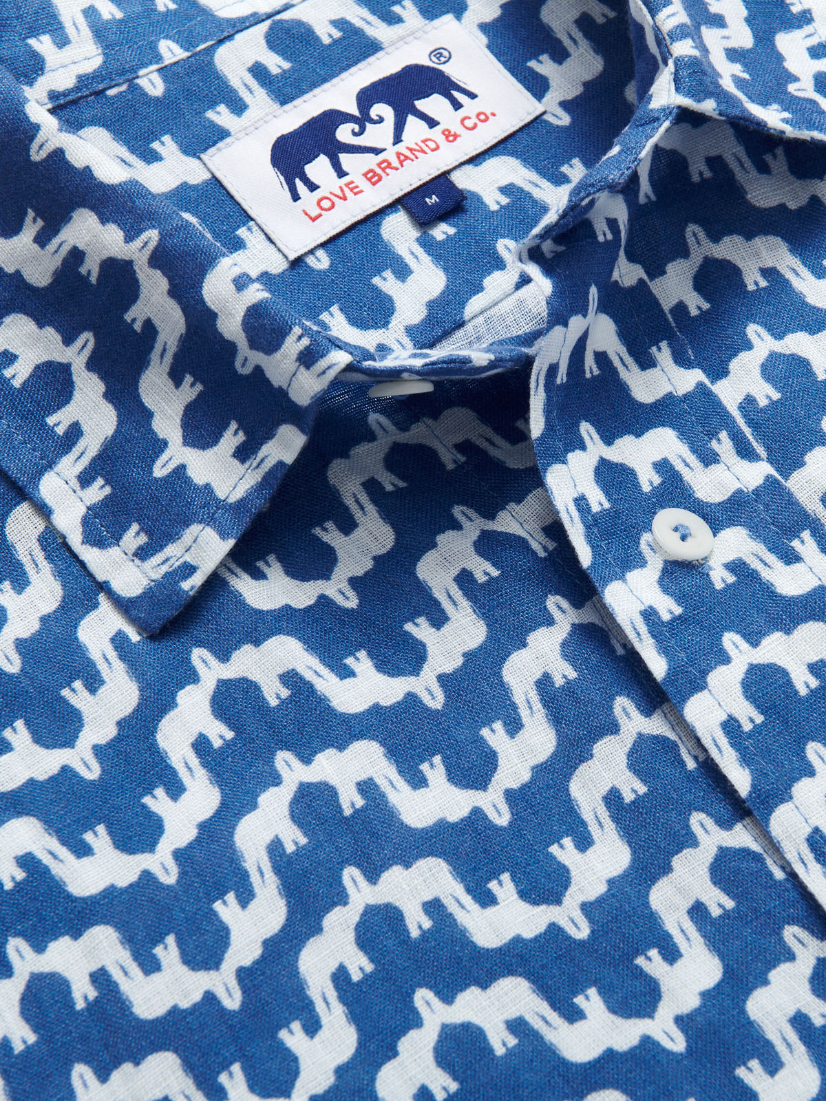 Elephant Palace Abaco Blue mens Linen Shirt. Close-up of elephant palace print with button-up design.