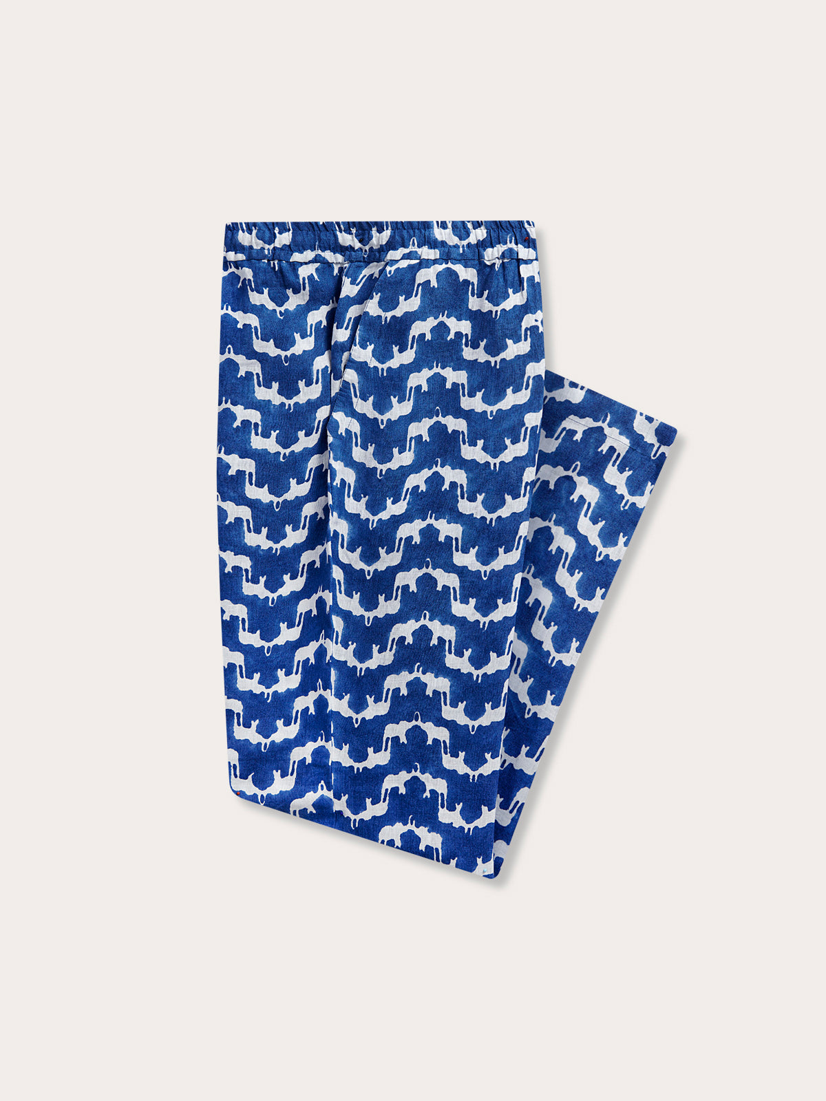 Blue linen pants mens in Elephant Palace Blue, featuring a unique elephant and palace block print pattern. Side view of men’s navy linen pants showing side pocket.