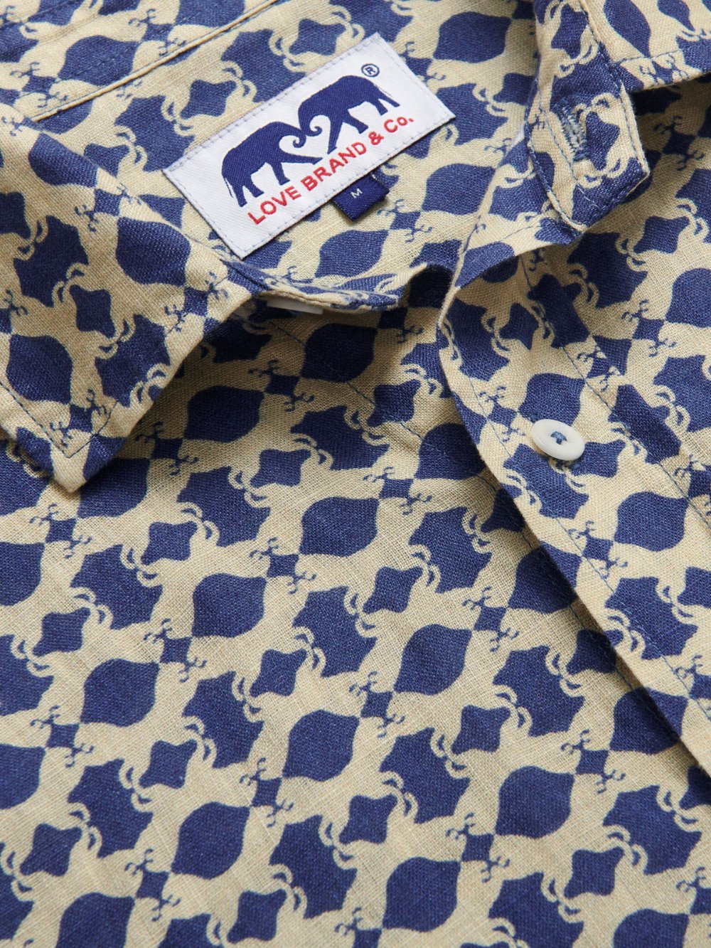 Close-up of Eye of the Tiger Abaco mens Linen Shirt. Blue and stone coloured mens linen shirt.