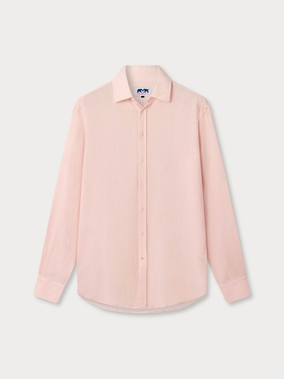 Pink shirt with long sleeves on a light gray background