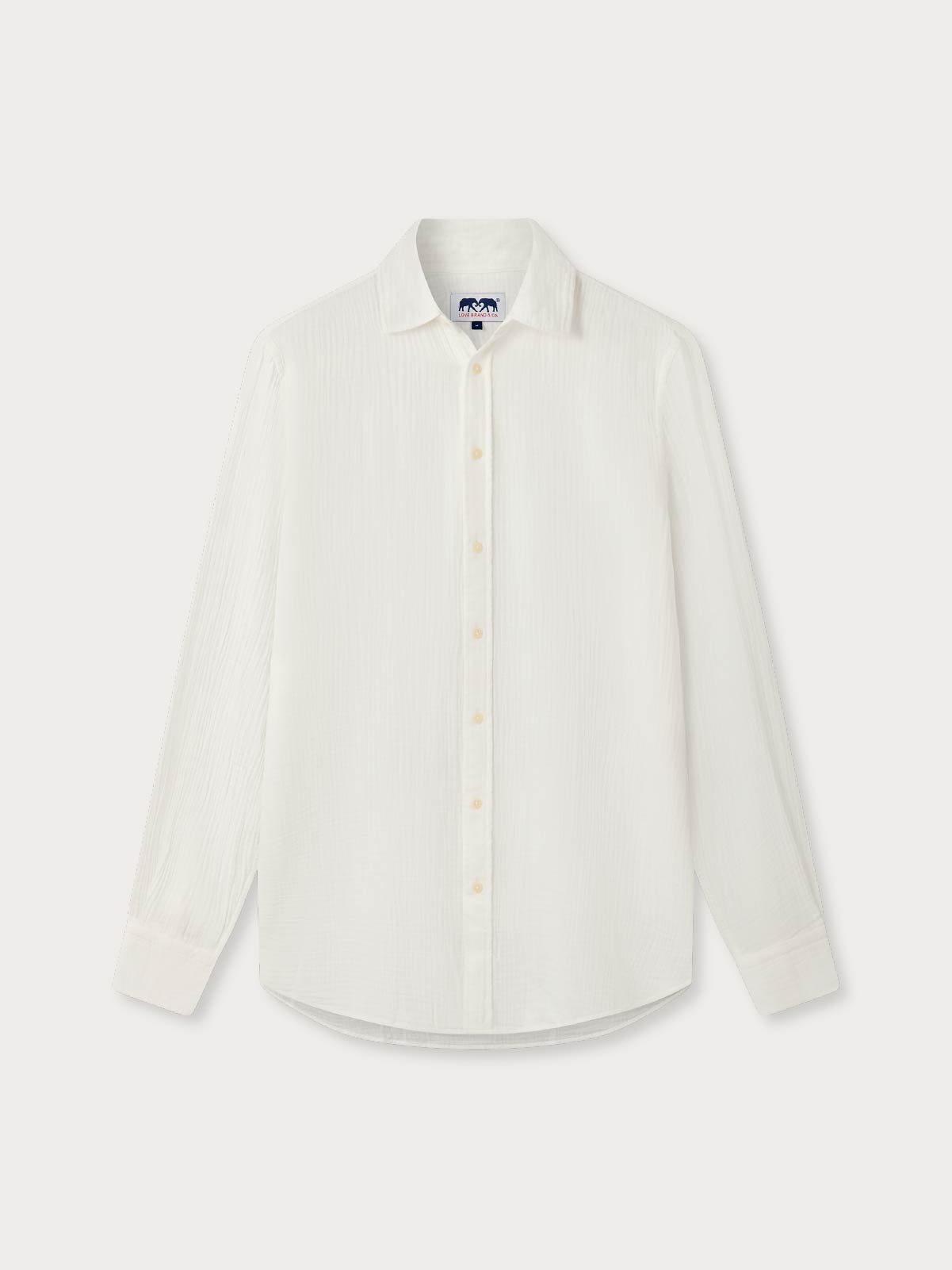 White shirt crafted from 100% cotton on a grey background