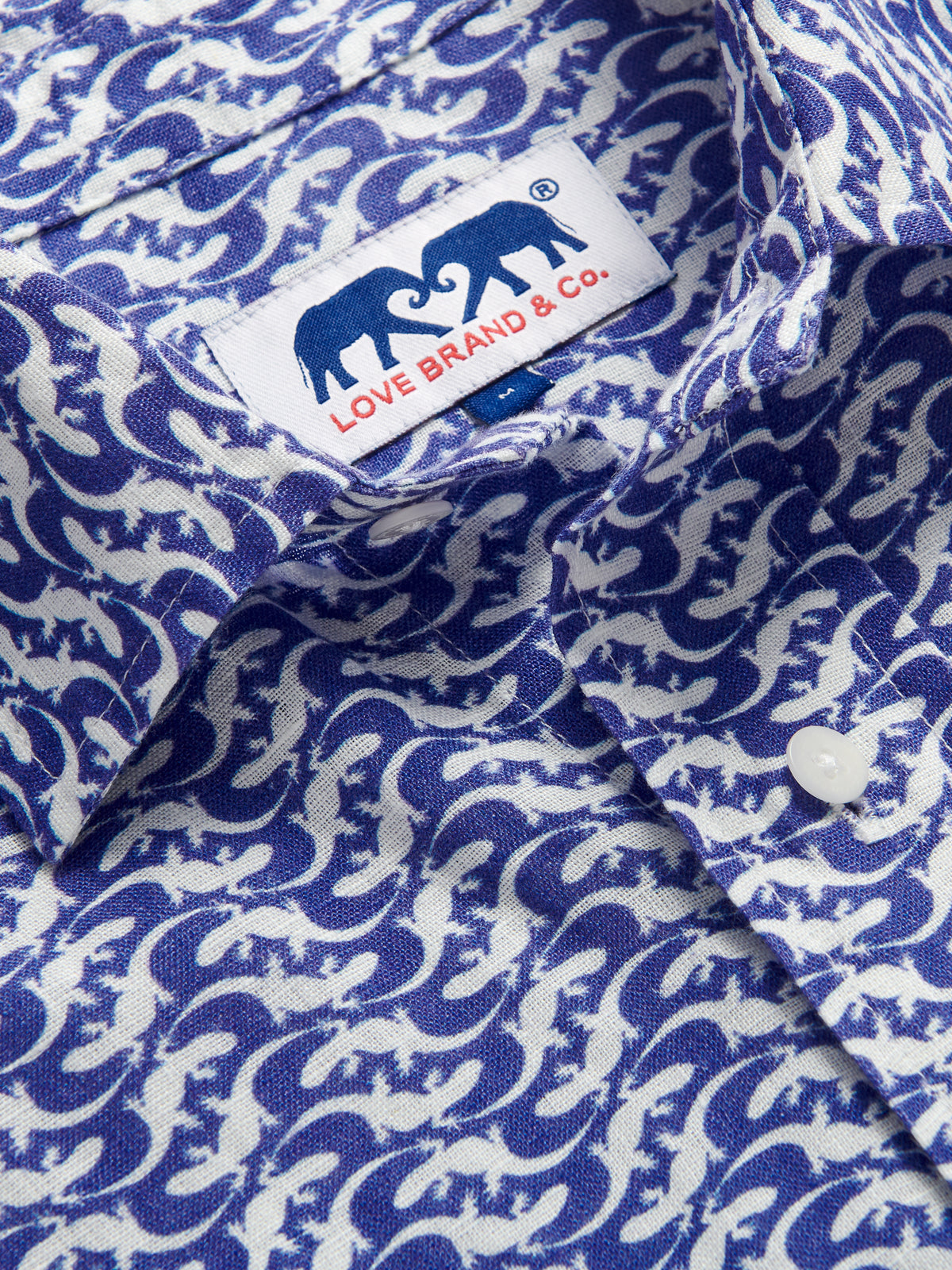 Close-up collar view of Men's Gecko Island Abaco Linen Shirt showcasing love brand logo