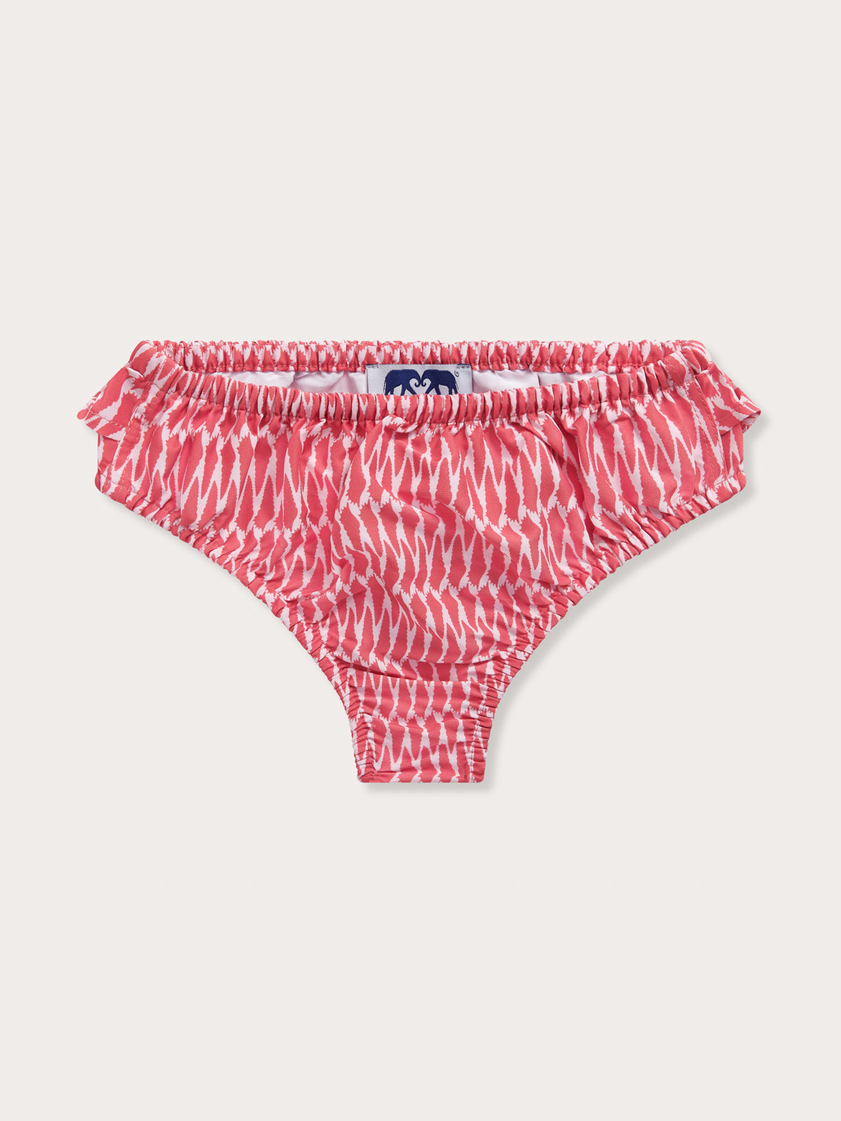 Front view of Girls Hot as Shell Calabash Bikini Bottoms. White and red patterned girls swimwear.