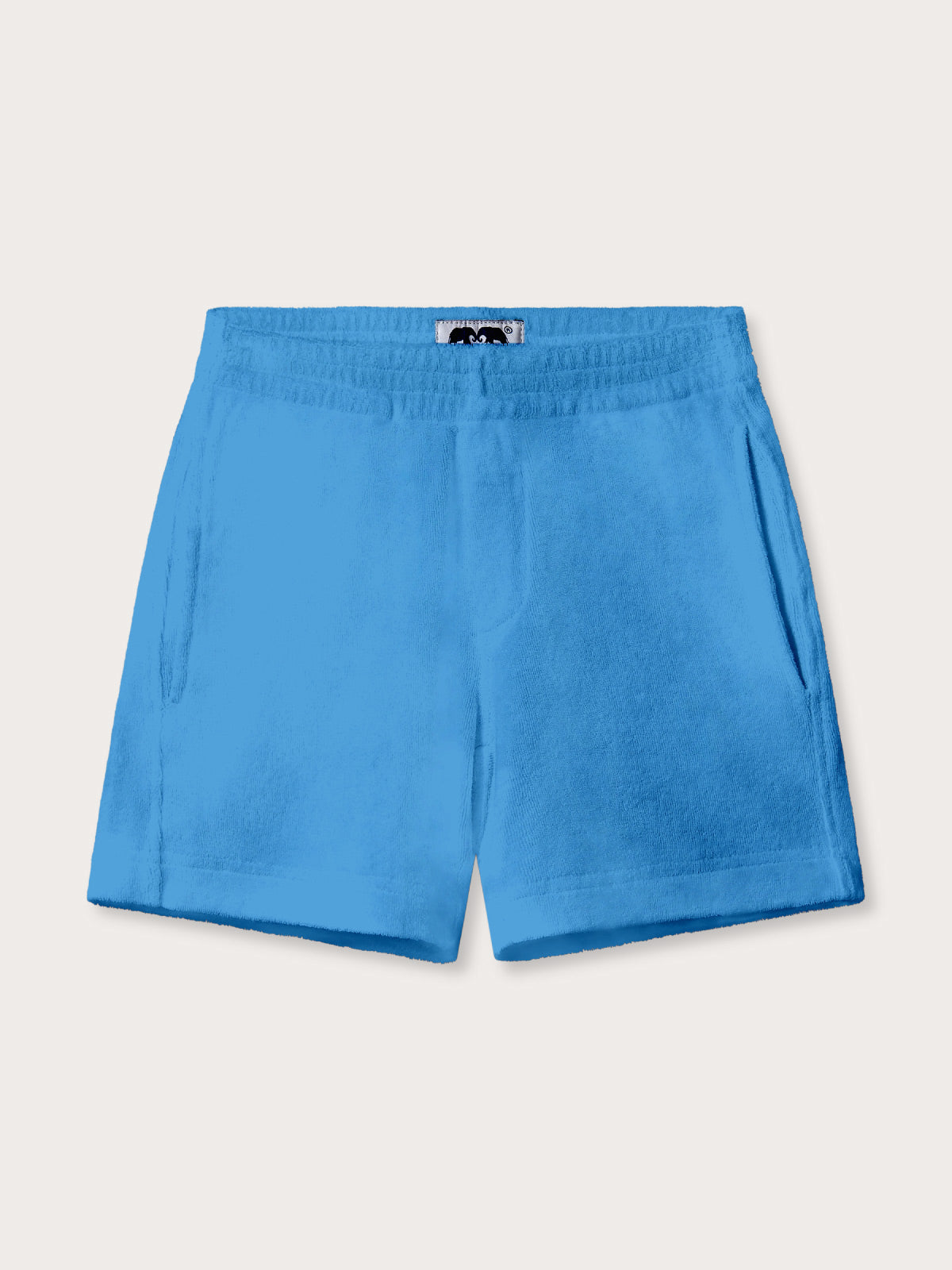 Front view of kids blue terry towelling shorts with pockets.