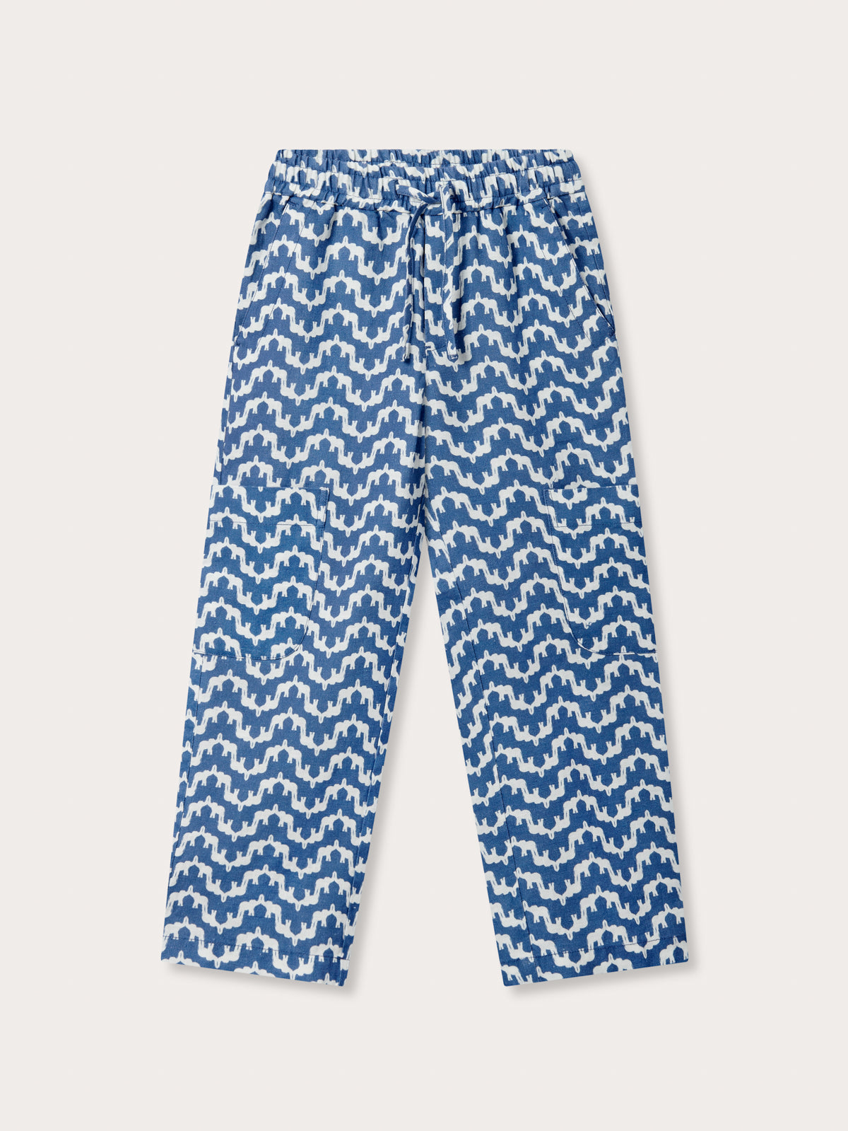Front view of Kids Elephant Palace Blue Eleuthera Linen Trousers. White and blue patterned linen pants for kids.
