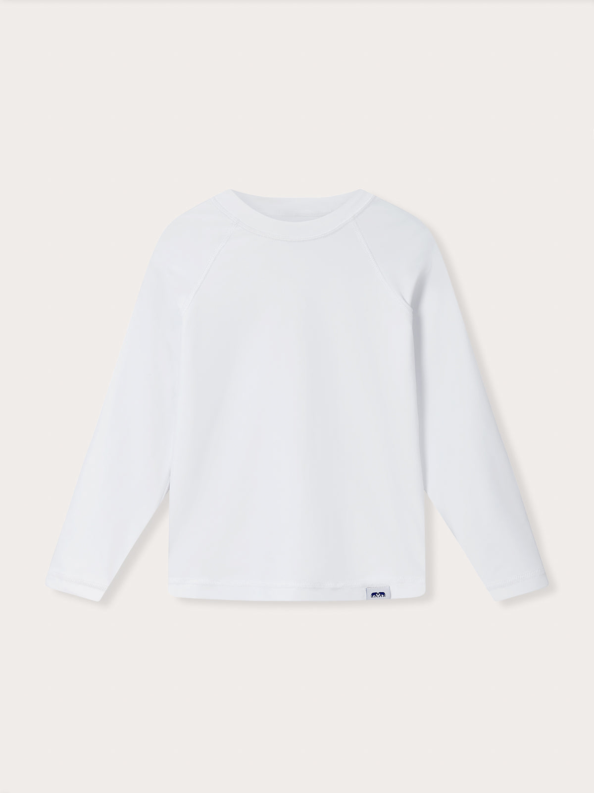 Front view of Kids White Harbour Rash Guard. Long-sleeved white rash vest for kids.