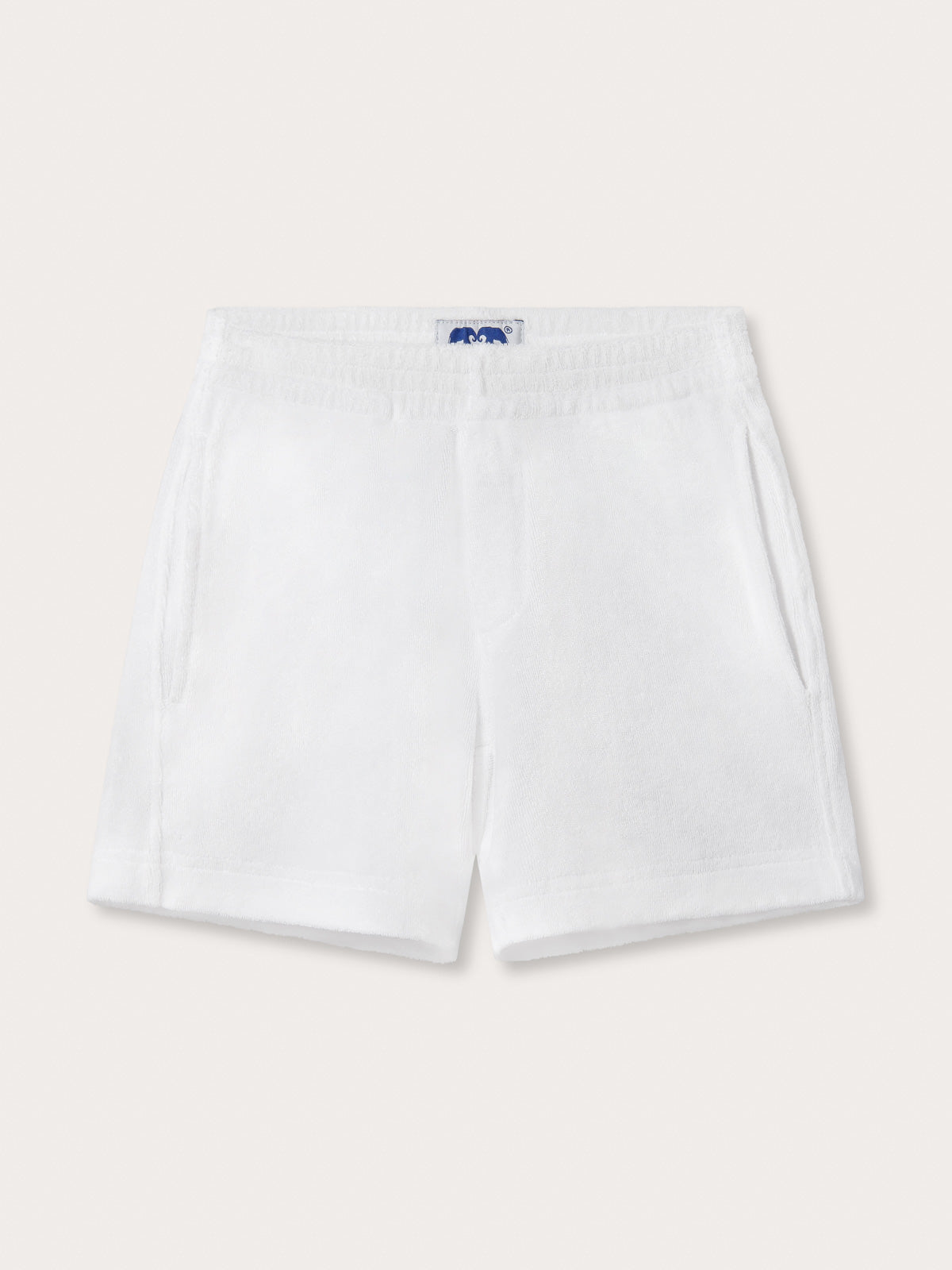 Front view of Kids White Holmes Terry Shorts. White shorts for children with handy front pockets.