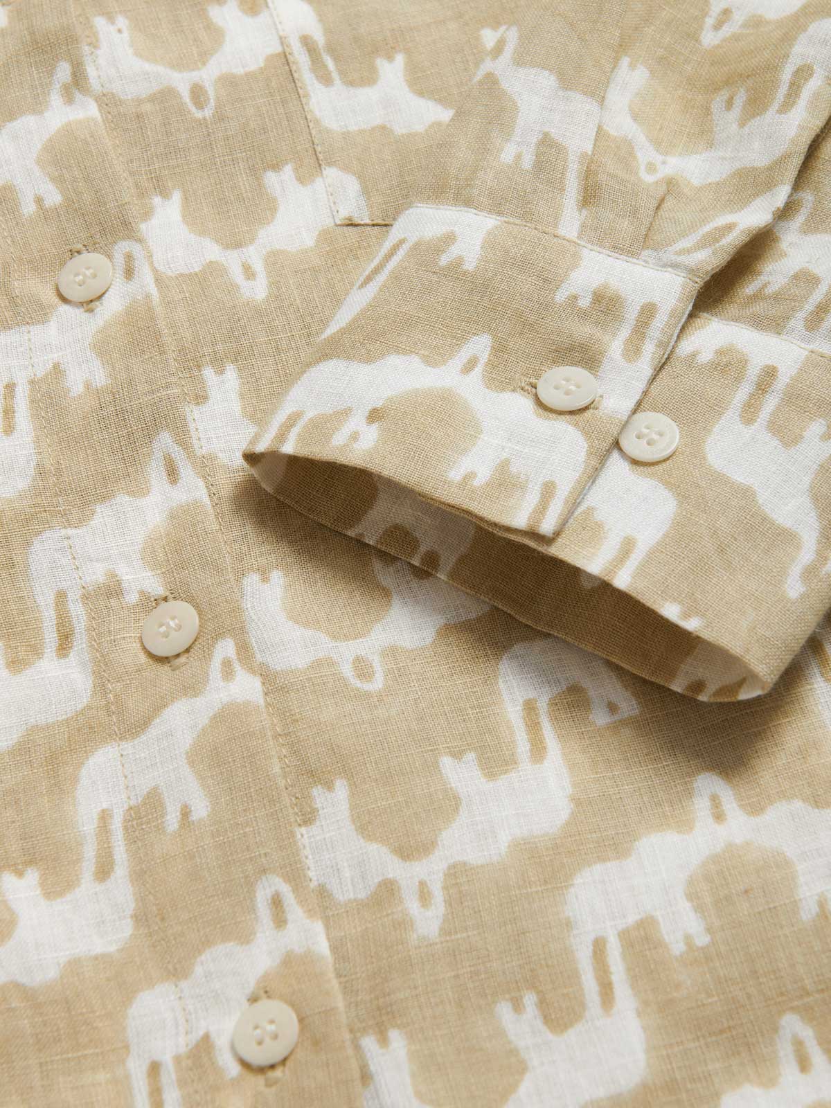 Womens Elephant Palace Coconut Sapodilla Linen Shirt Dress close-up view of beige and white cuffs and corozo nut buttons.