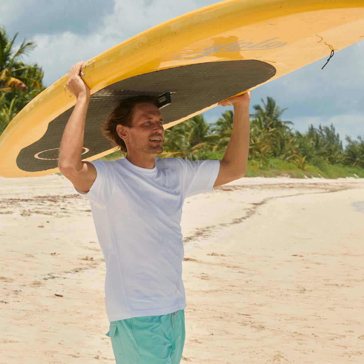 love brand beachwear featuring white cotton shirt and green swimming trunks