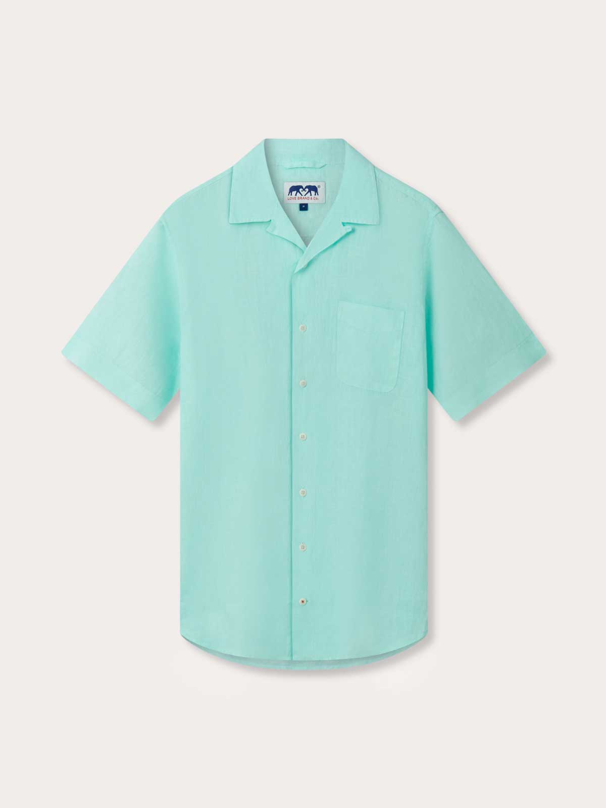 Front view of Men's Cay Green Arawak Linen Shirt. Short sleeved linen shirt in mint green with side pocket.