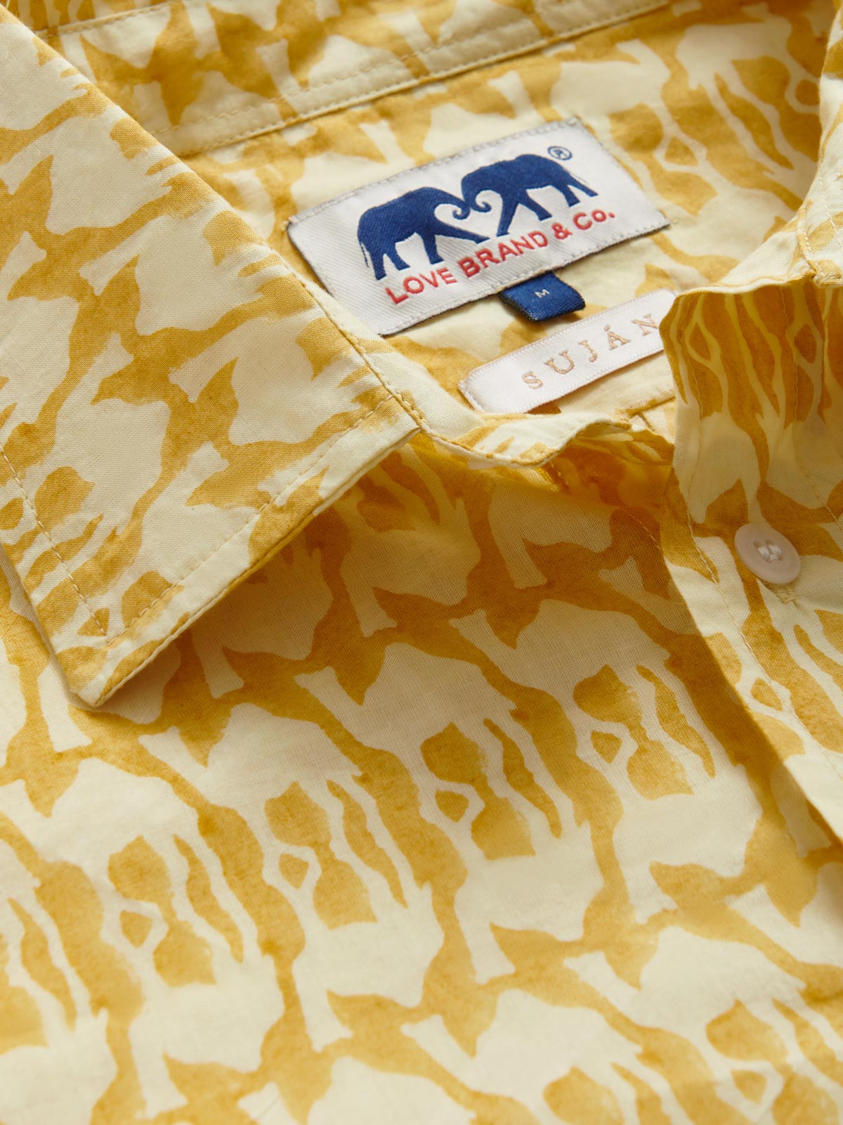 Collar view of Men's Camel Mirage Abaco Cotton Shirt. Yellow camel design for SUJAN Camp.