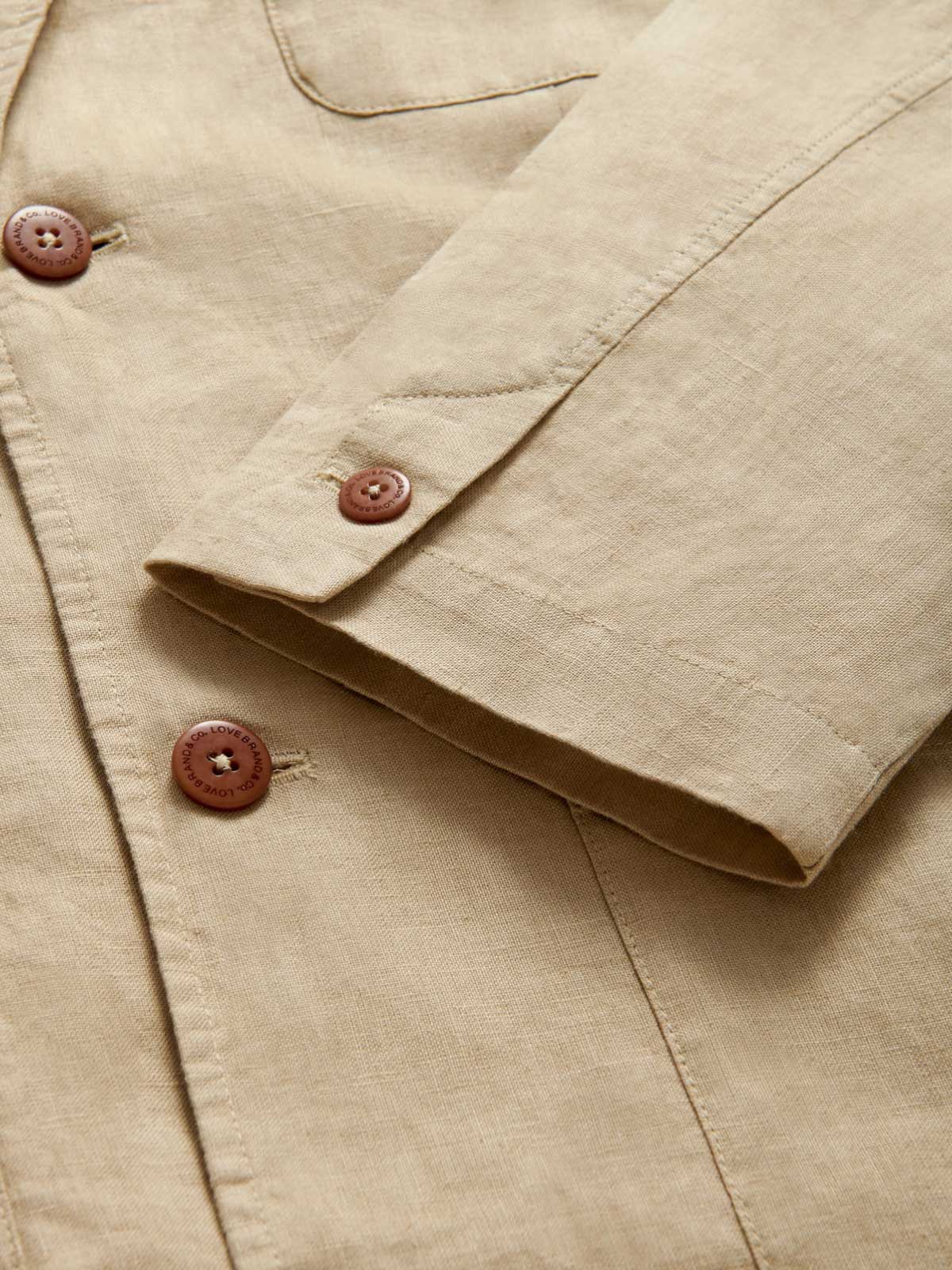 Close-up cuff view of Men's Coconut Nassau Linen Jacket.