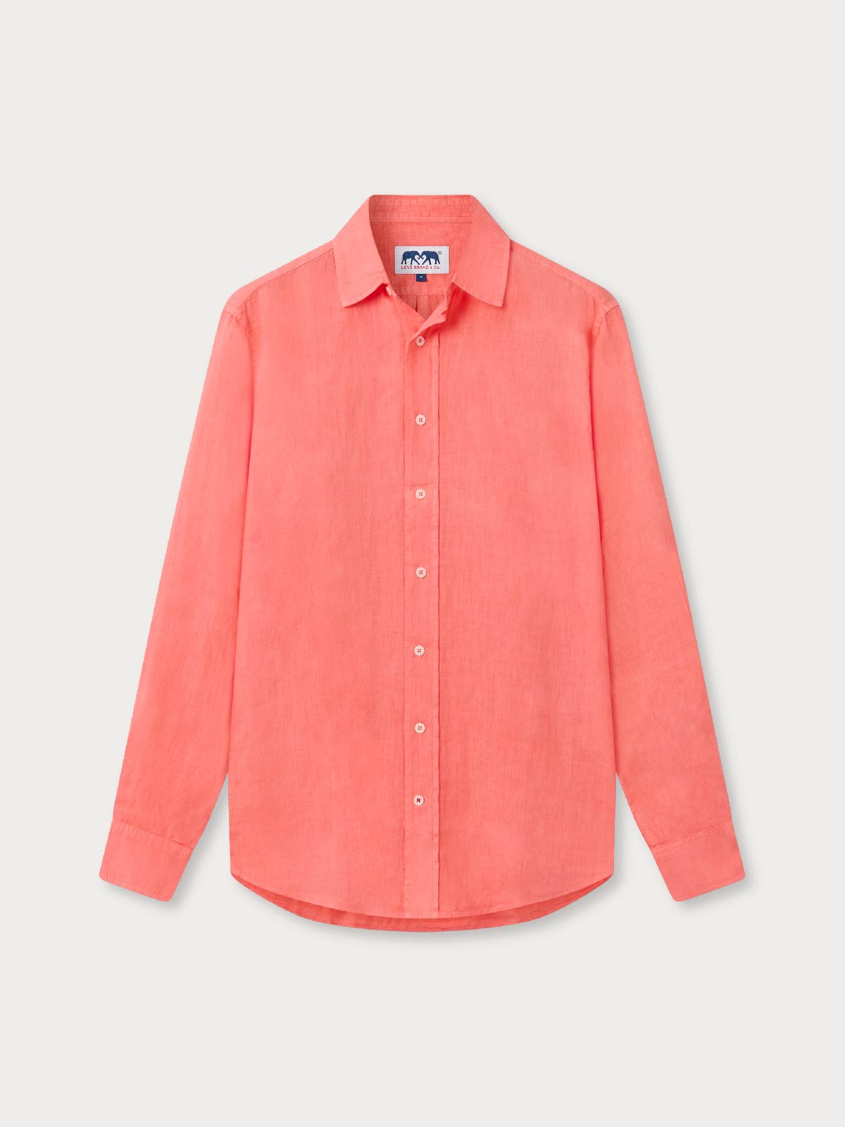 Coral-coloured pink linen shirt with long sleeves.