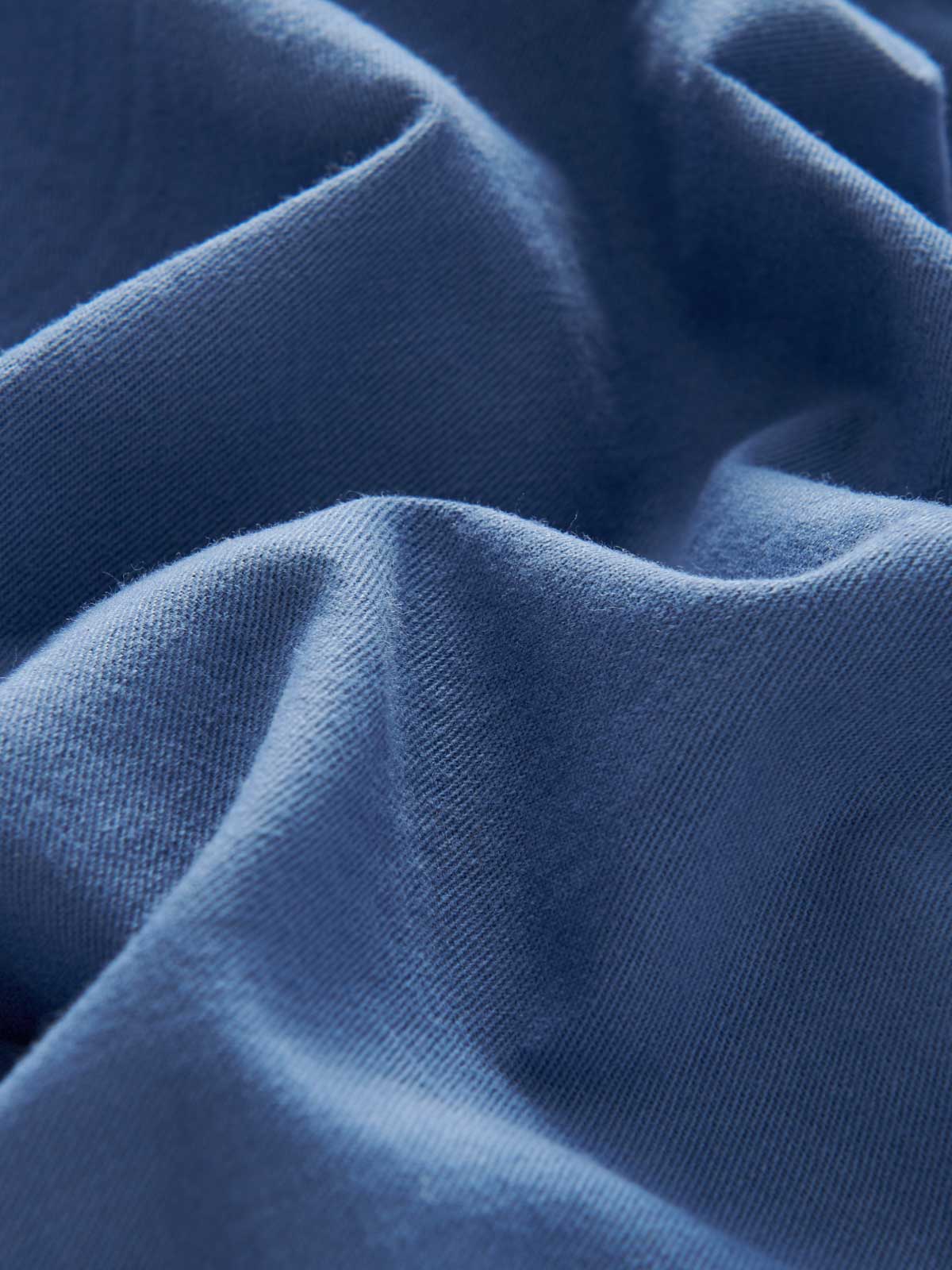 Close-up fabric view of Men's Deep Blue Harvey Cotton Shorts. Blue fabric made from 100% cotton.