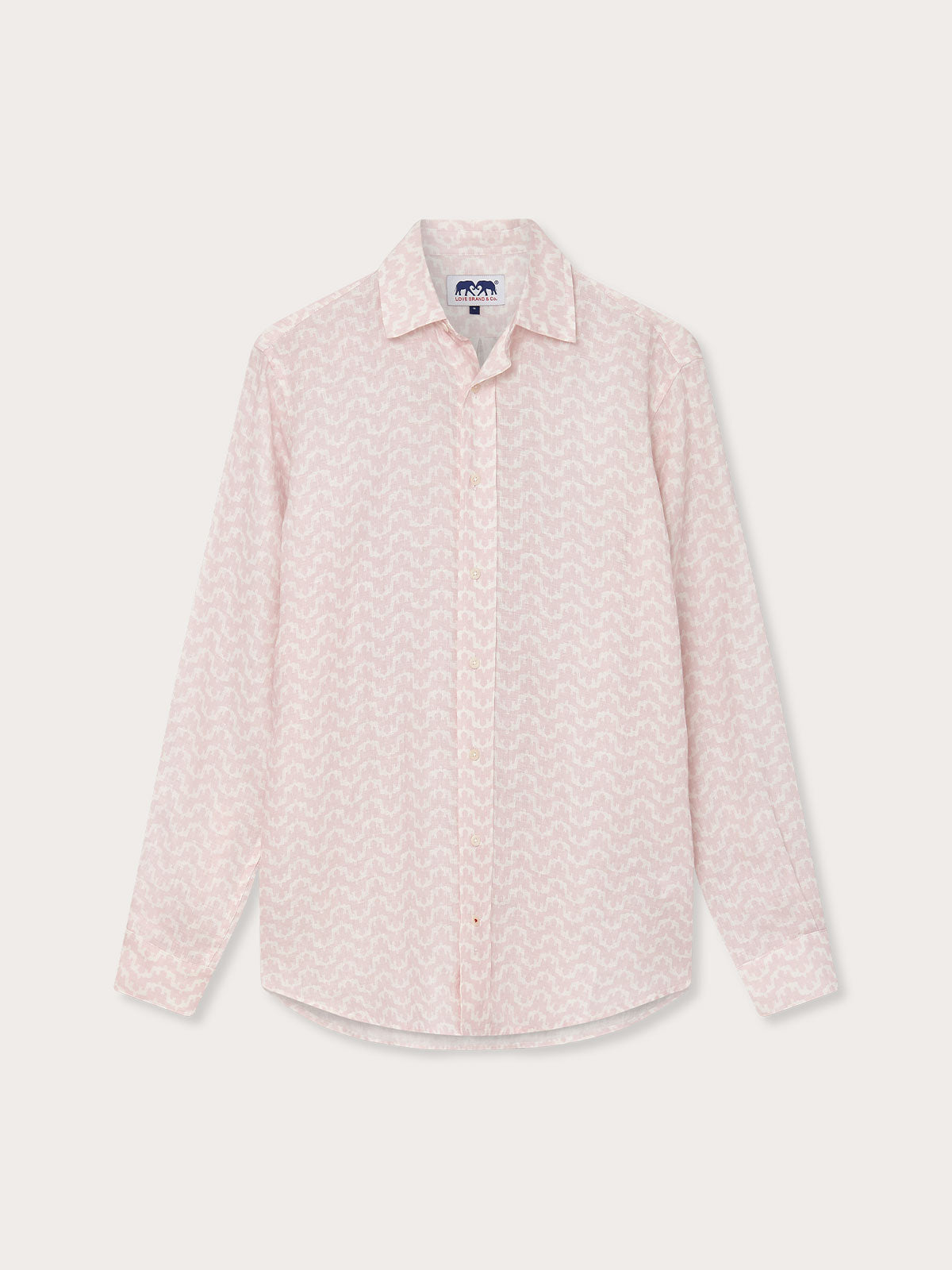 Men's Elephant Palace Pink Abaco Linen Shirt hanging on a white background. Old money shirts featuring a light pink color with subtle patterns, long sleeves, and a collar.