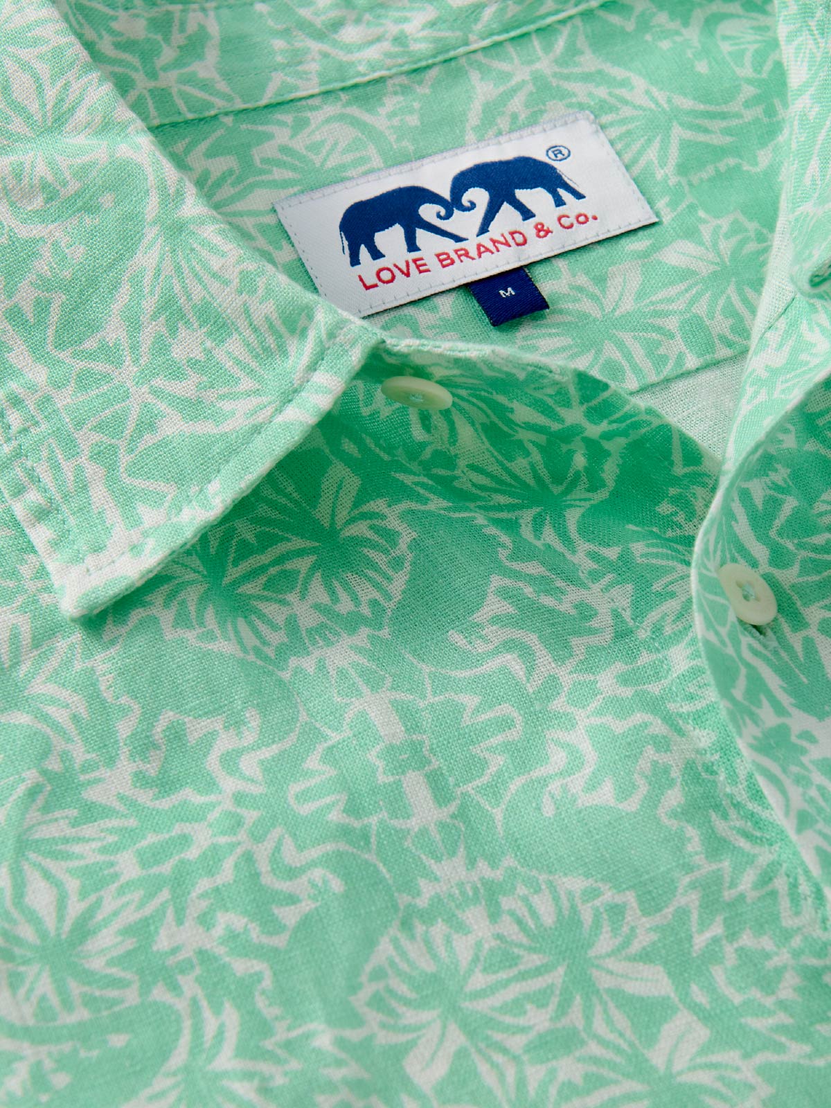 Green patterned shirt with a visible love brand label