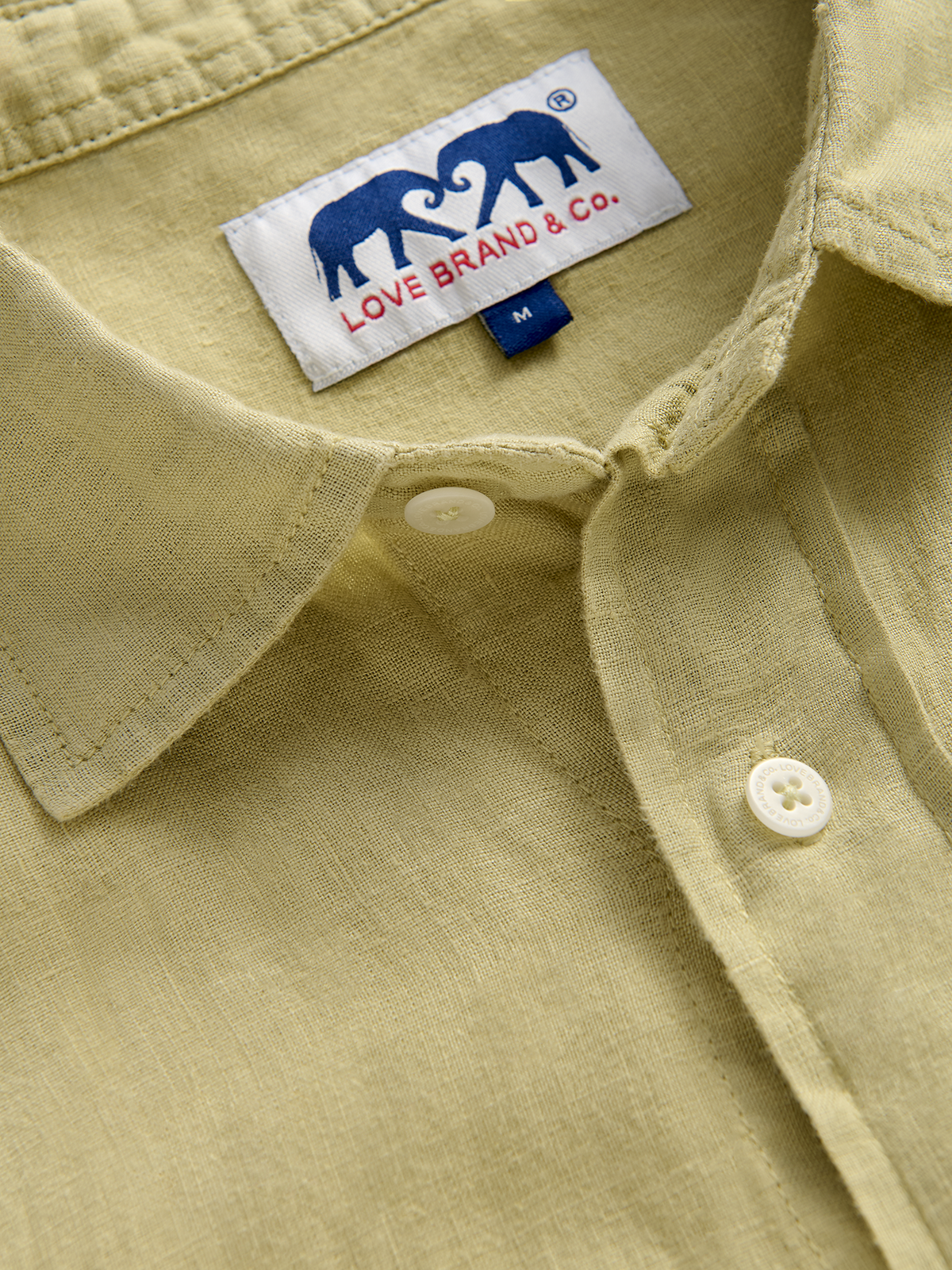 Close-up collar view of a khaki hemp shirt