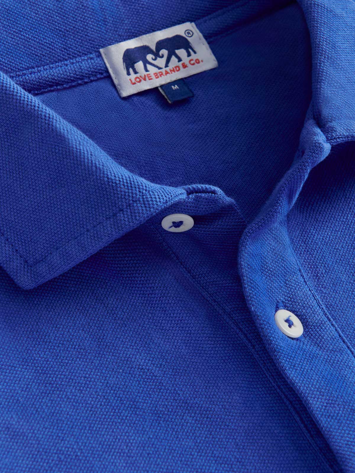 Close-up view of Men's Majorelle Blue Pensacola Polo Shirt made from 100% organic cotton.