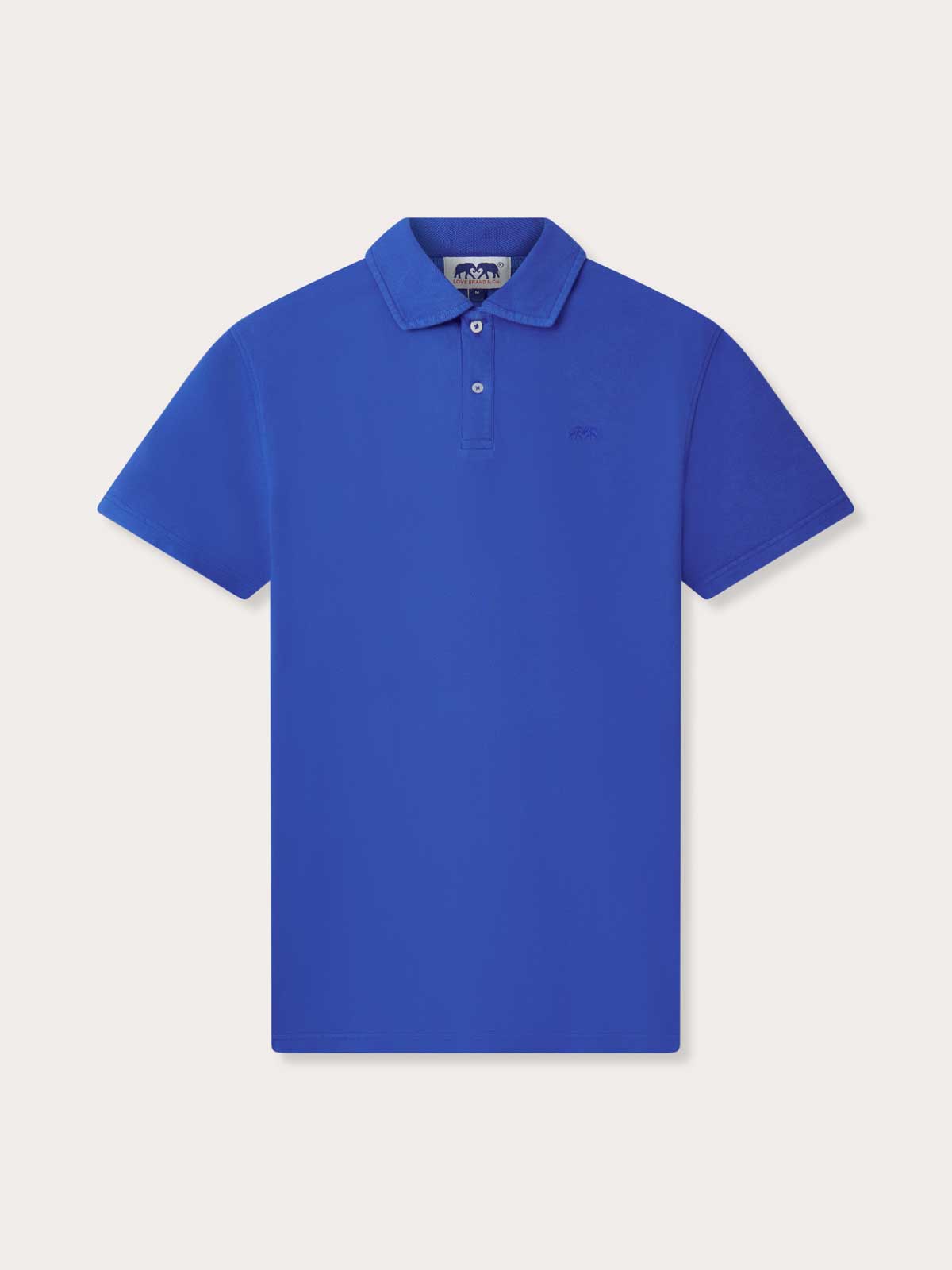 Men's Majorelle Blue Pensacola Polo Shirt made from 100% organic cotton, displayed against a light neutral background.