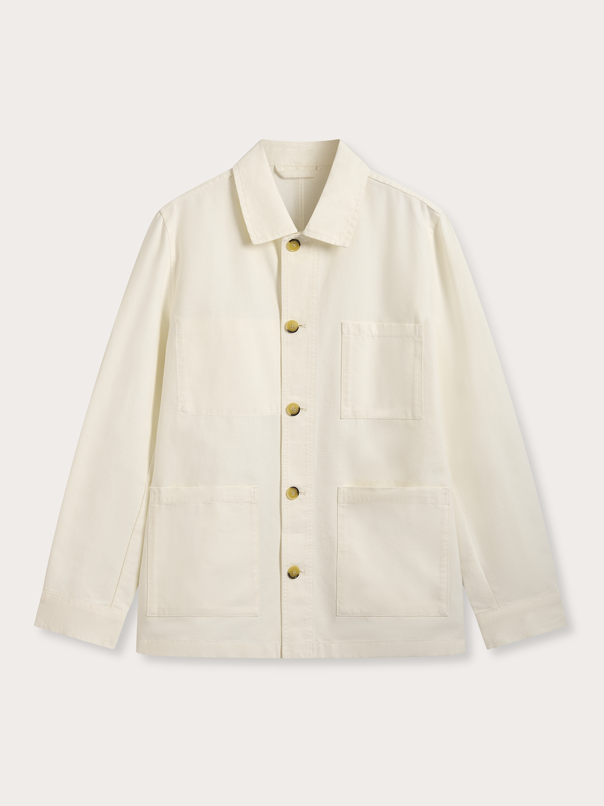 An off-white canvas utility jacket with tortoiseshell buttons, featuring a pointed collar, chest pocket, and two large front patch pockets, shown flat on a light beige background.