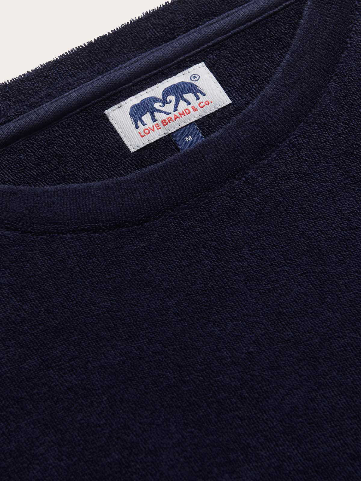 Close-up view of the fabric of Men's Navy Blue Russell Terry T-Shirt. Navy blue t-shirt crafted from 100% cotton terry towelling material in a relaxed fit.