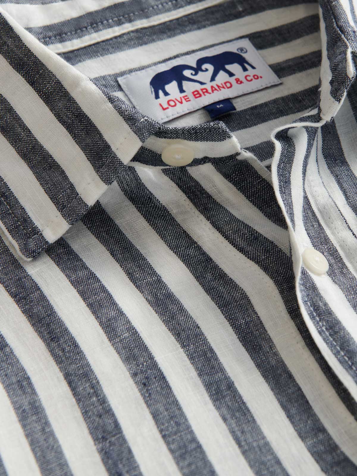 Detailed view of Men's Navy Lines Abaco Linen Shirt. Linen shirt with white and navy stripes.