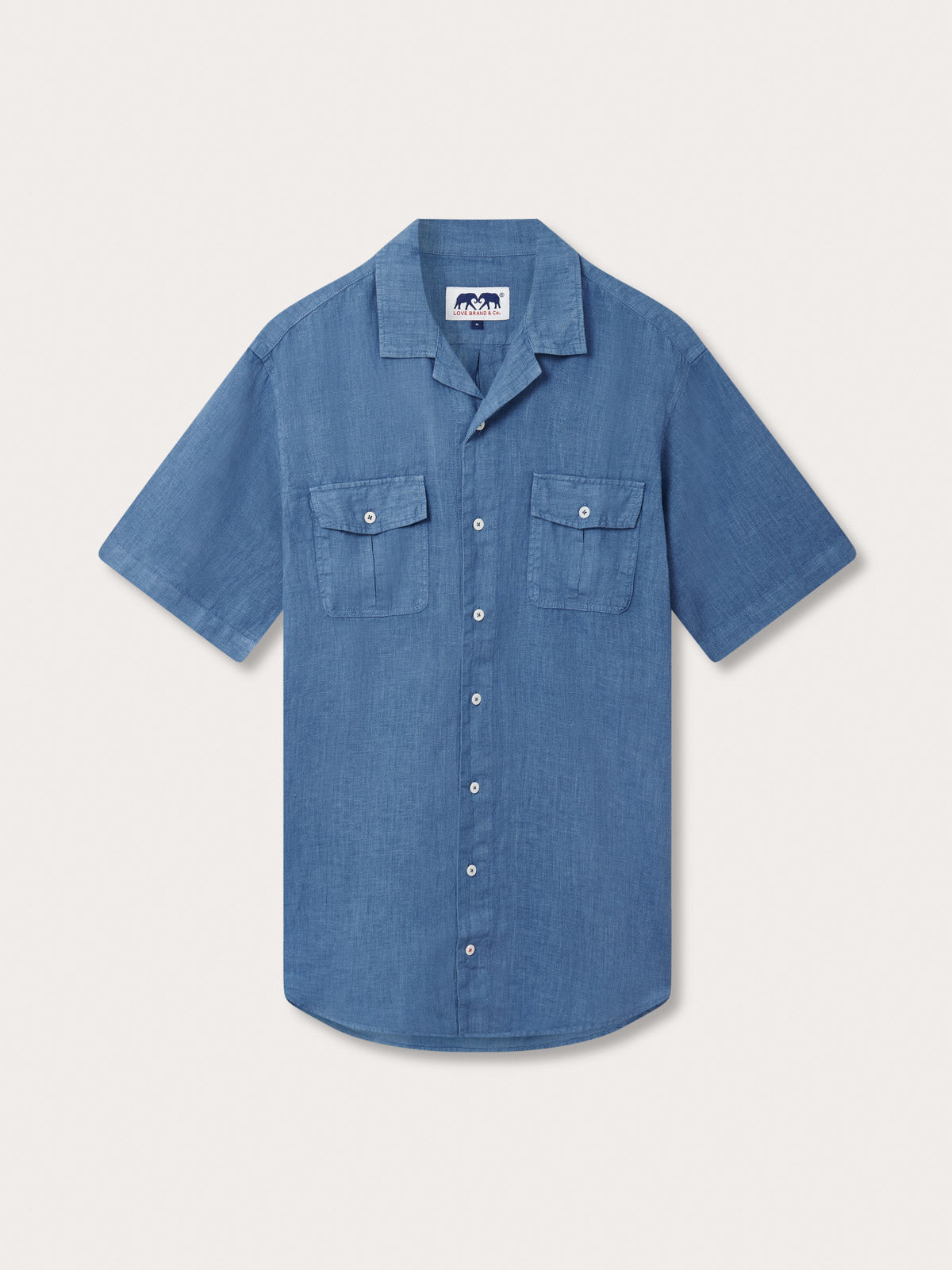 Men's Deep Blue Normans Linen Shirt. Blue short-sleeved linen shirt with 2 double breast pockets with a button-up design.