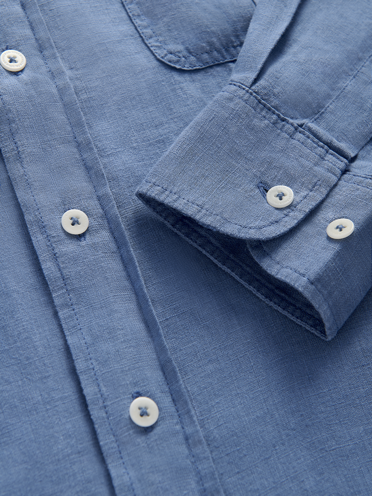 Close-up of a blue hemp shirt with buttons