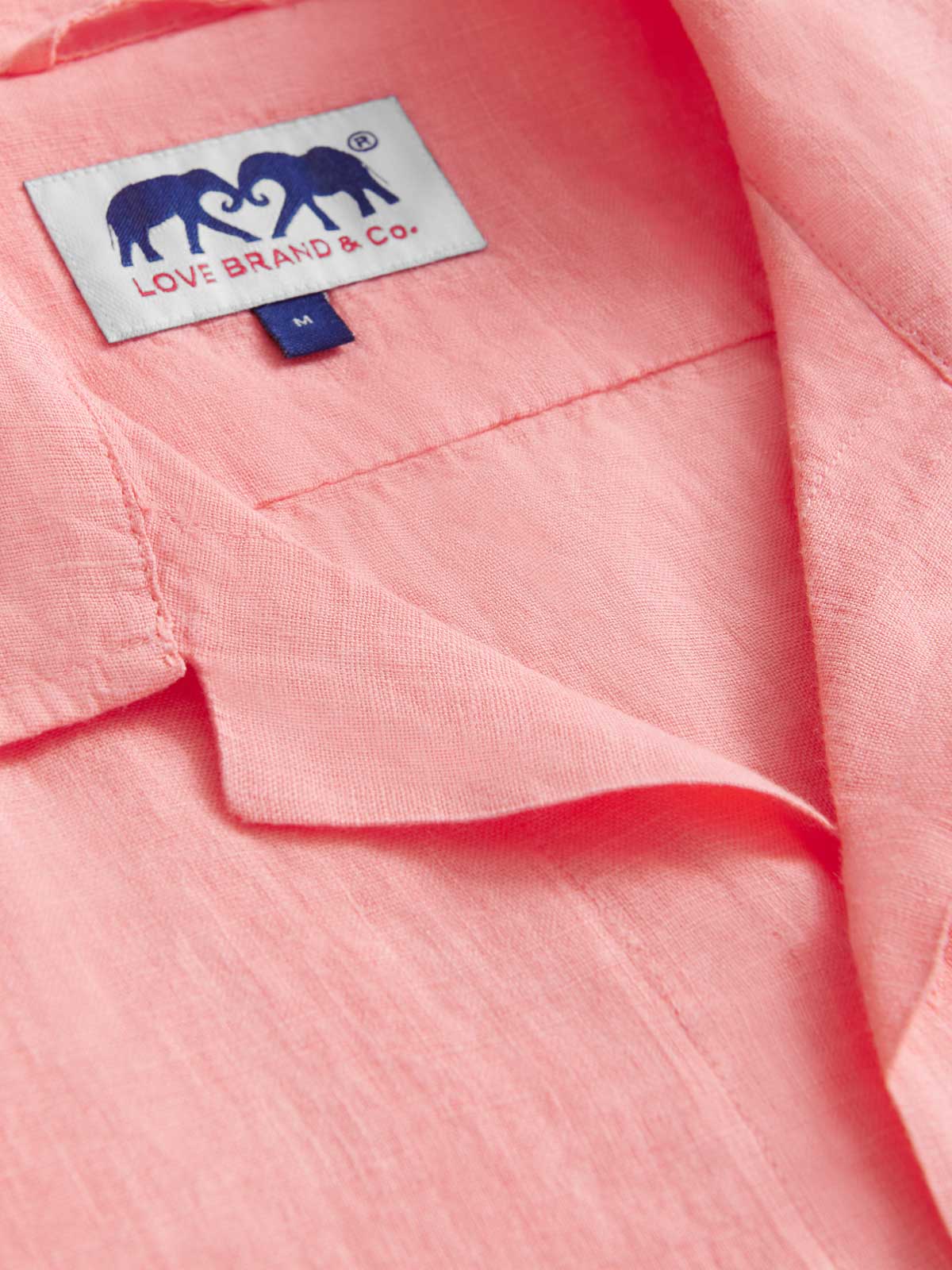 Close-up view of the collar of Men's Watermelon Arawak Linen Shirt. Part of our mens linen short sleeve shirts collection.