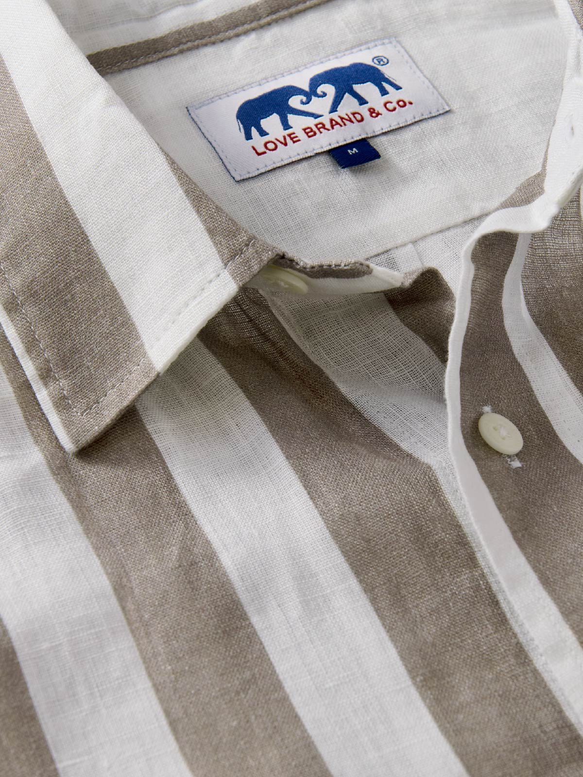 Close-up view of Mens brown striped shirt.