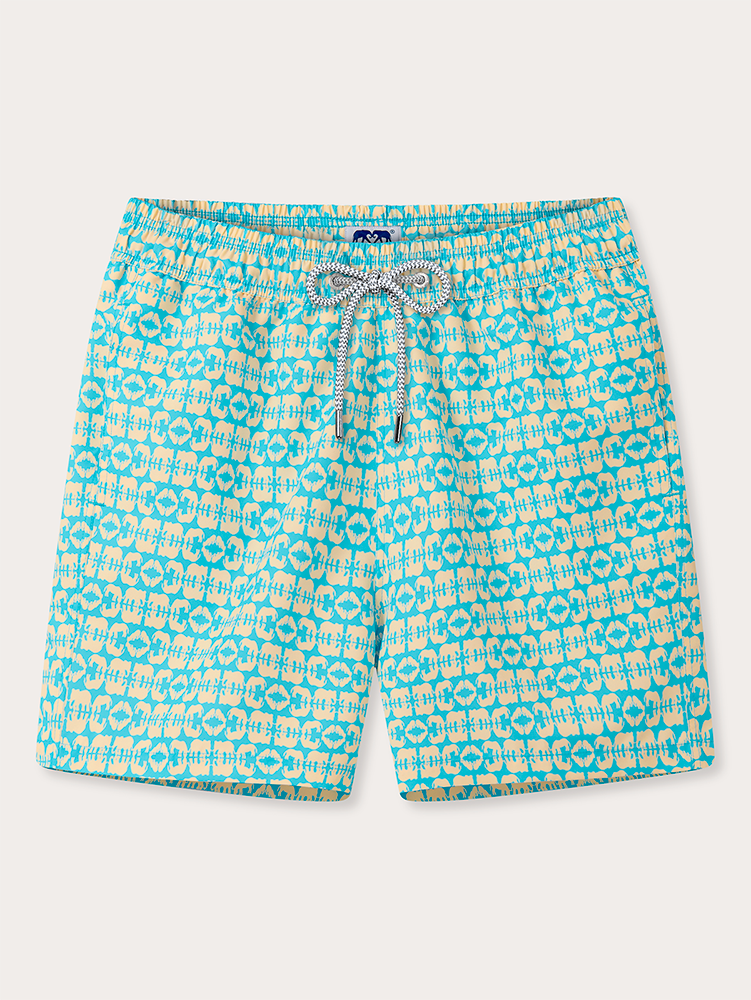 Blue and yellow patterned swim shorts on a white background
