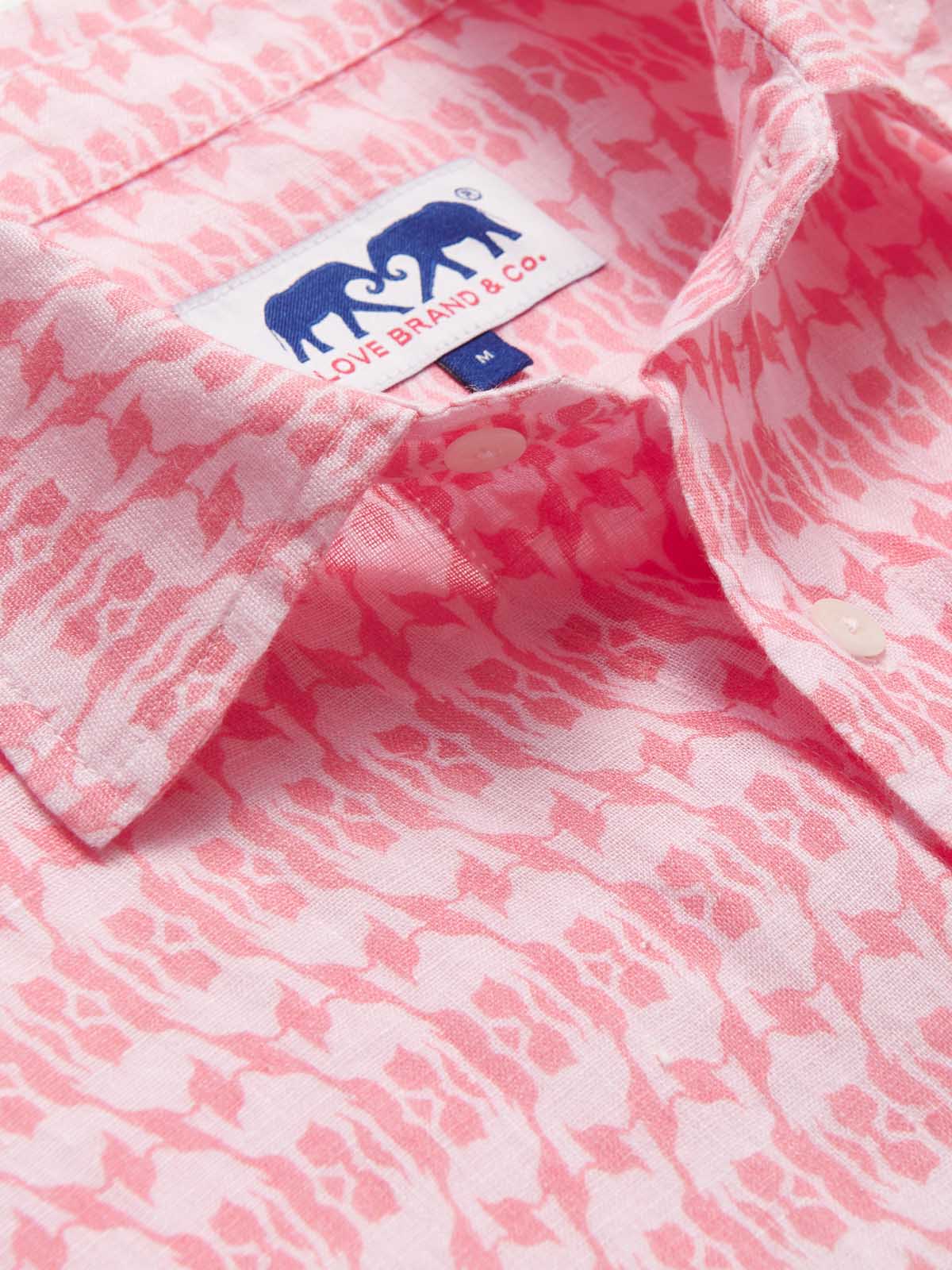 Close-up of Camel Mirage Pink Abaco men's Linen Shirt, showcasing a detailed pink mirage pattern with a visible Love Brand & Co. label. Old money shirts made from 100% linen.