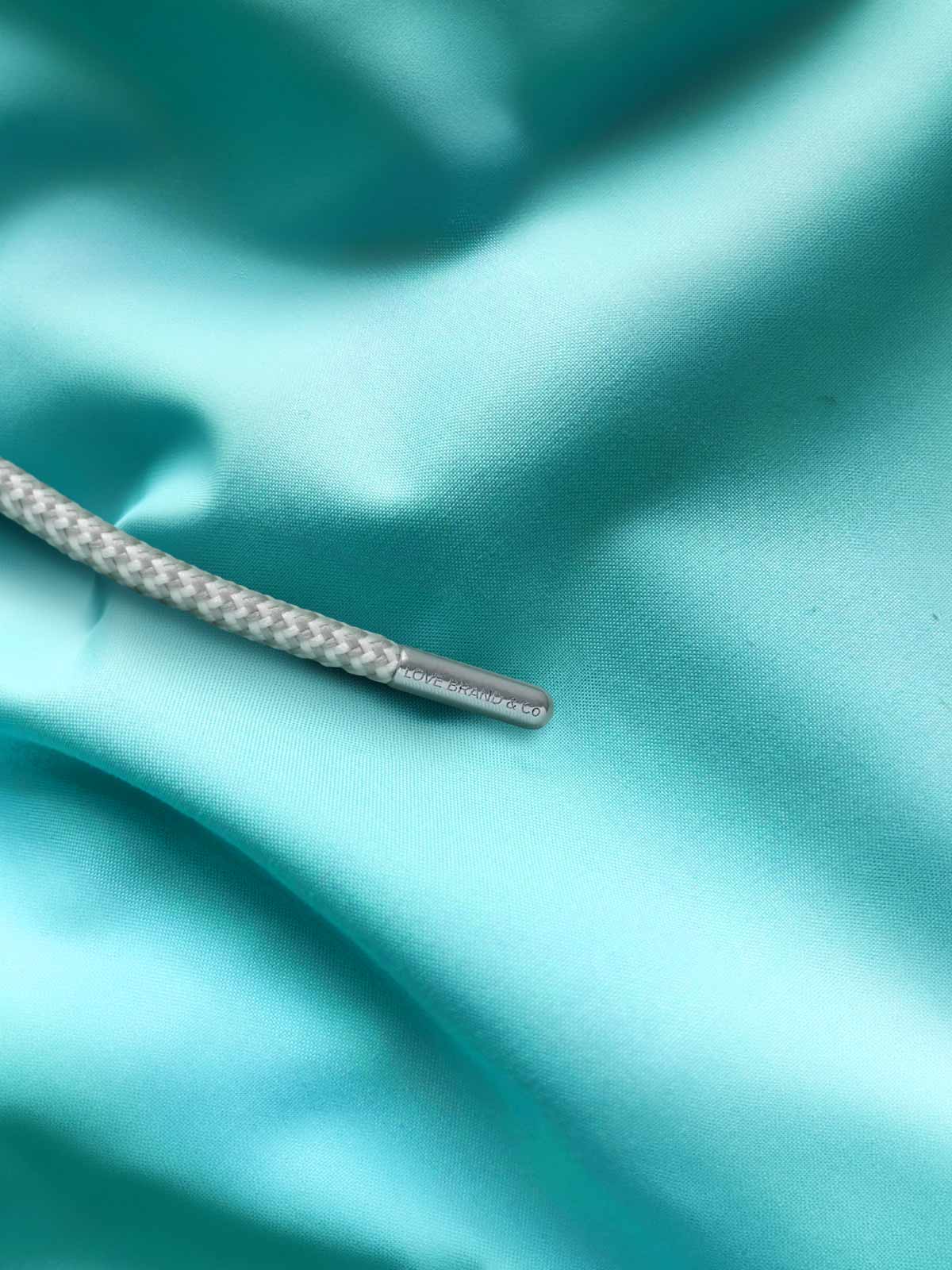 Close-up view of mens cay green swimming shorts