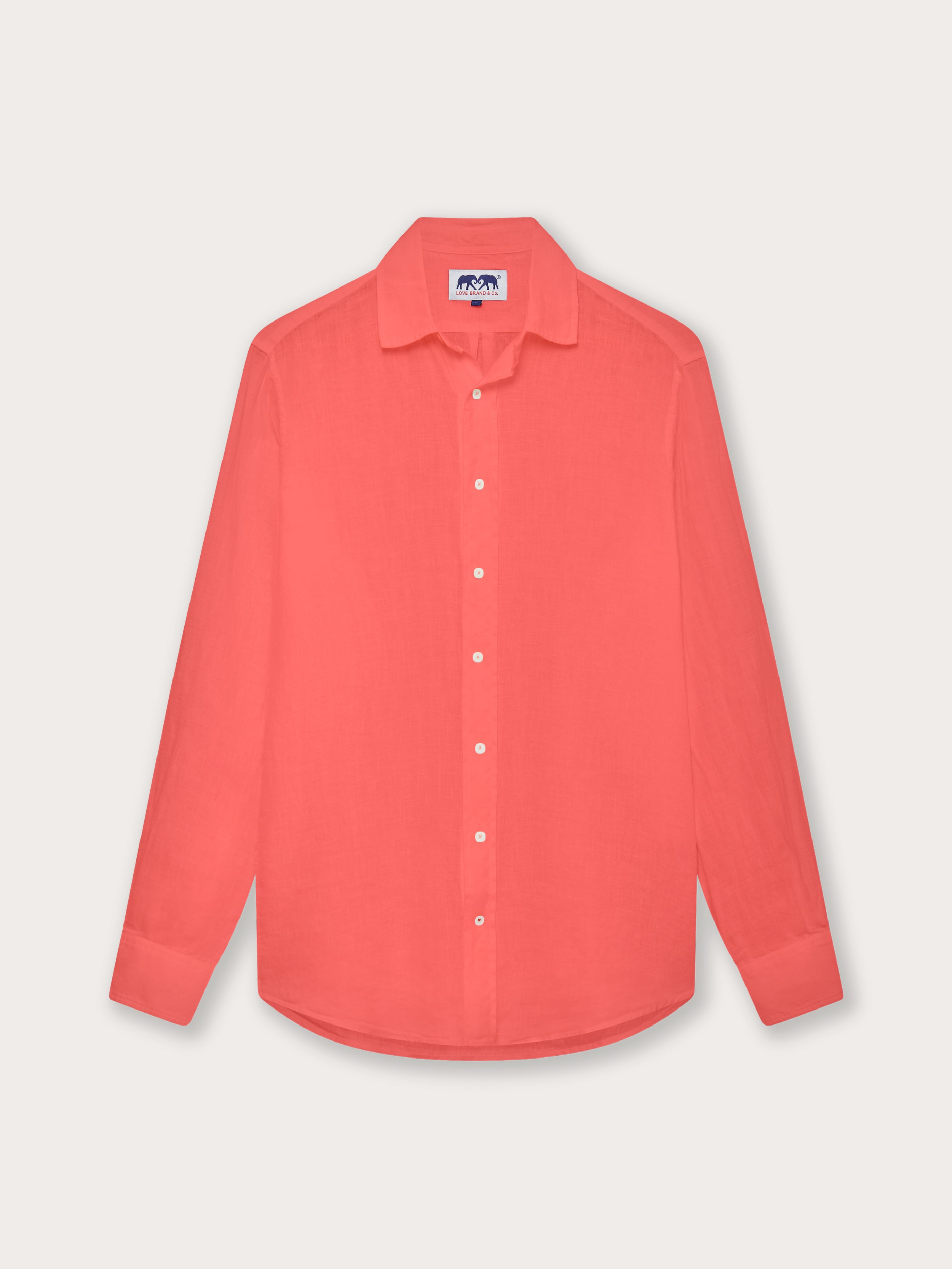 Front view of men's coral rose abaco linen shirt. Pink button-up linen shirt with long sleeves and a classic collar