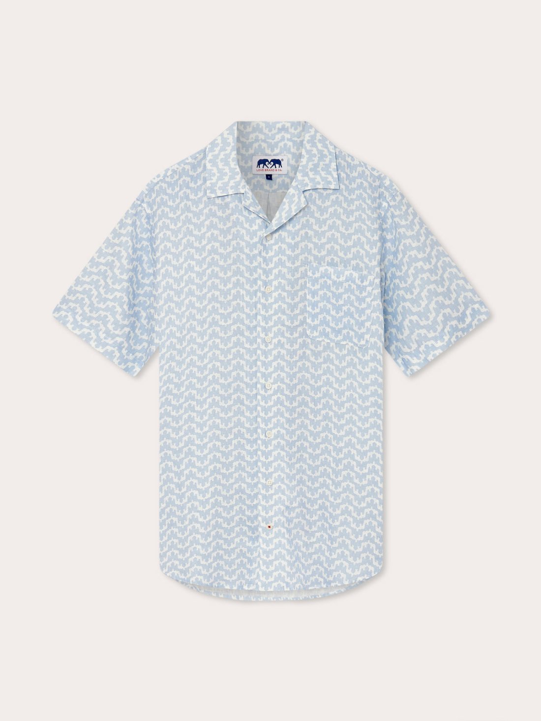 Men's Elephant Palace Sky Arawak Linen Shirt with elephant and Indian palace print. Men's linen shirt with short sleeves, and button-up front. Old money style shirt with camp collar in sky blue.