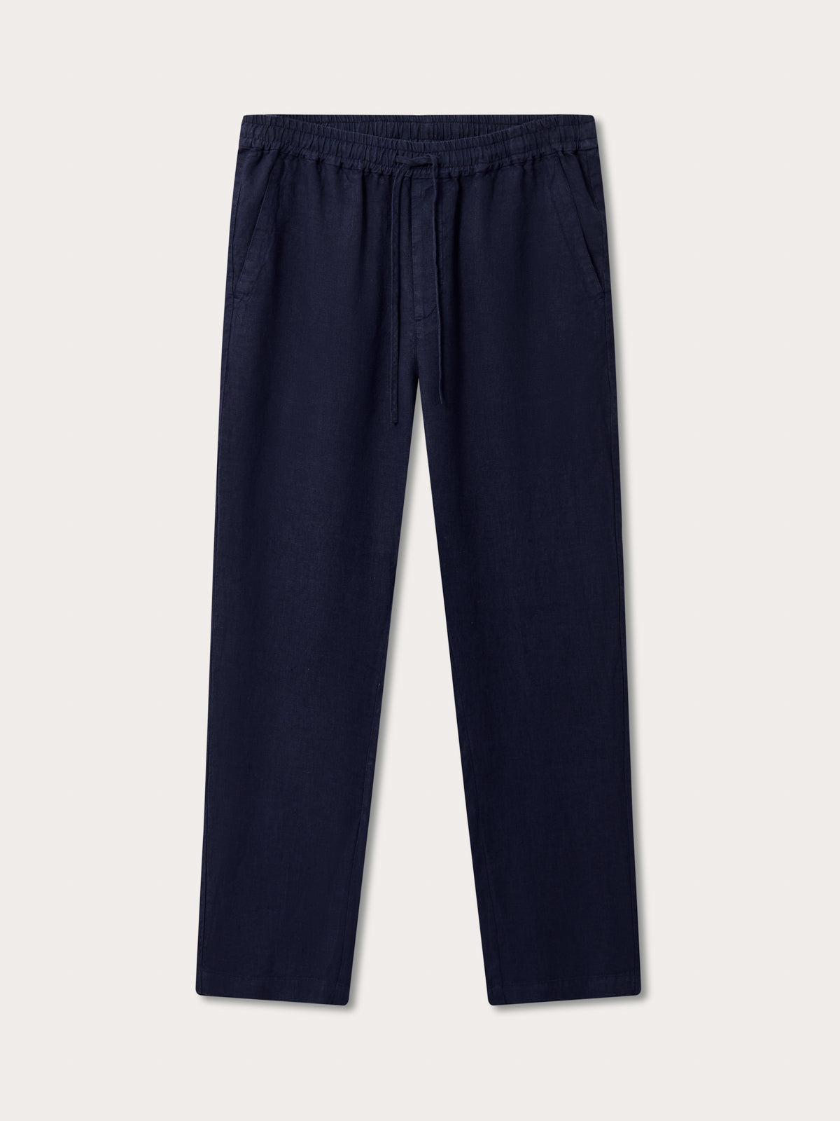 Front view of Men's Navy Blue Eleuthera Linen Trousers. Navy blue linen pants for men with 2 front pockets and drawstring waist in a relaxed fit.