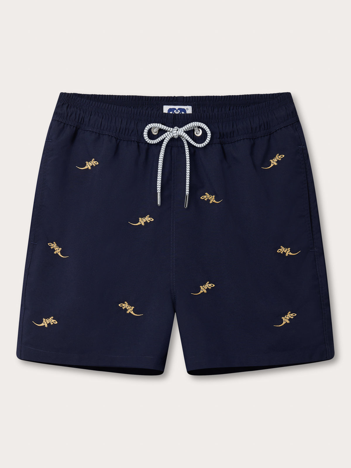 Front view of Men’s Off The Wall Embroidered Staniel Swim Shorts. Blue swim shorts with gold embroidered geckos.