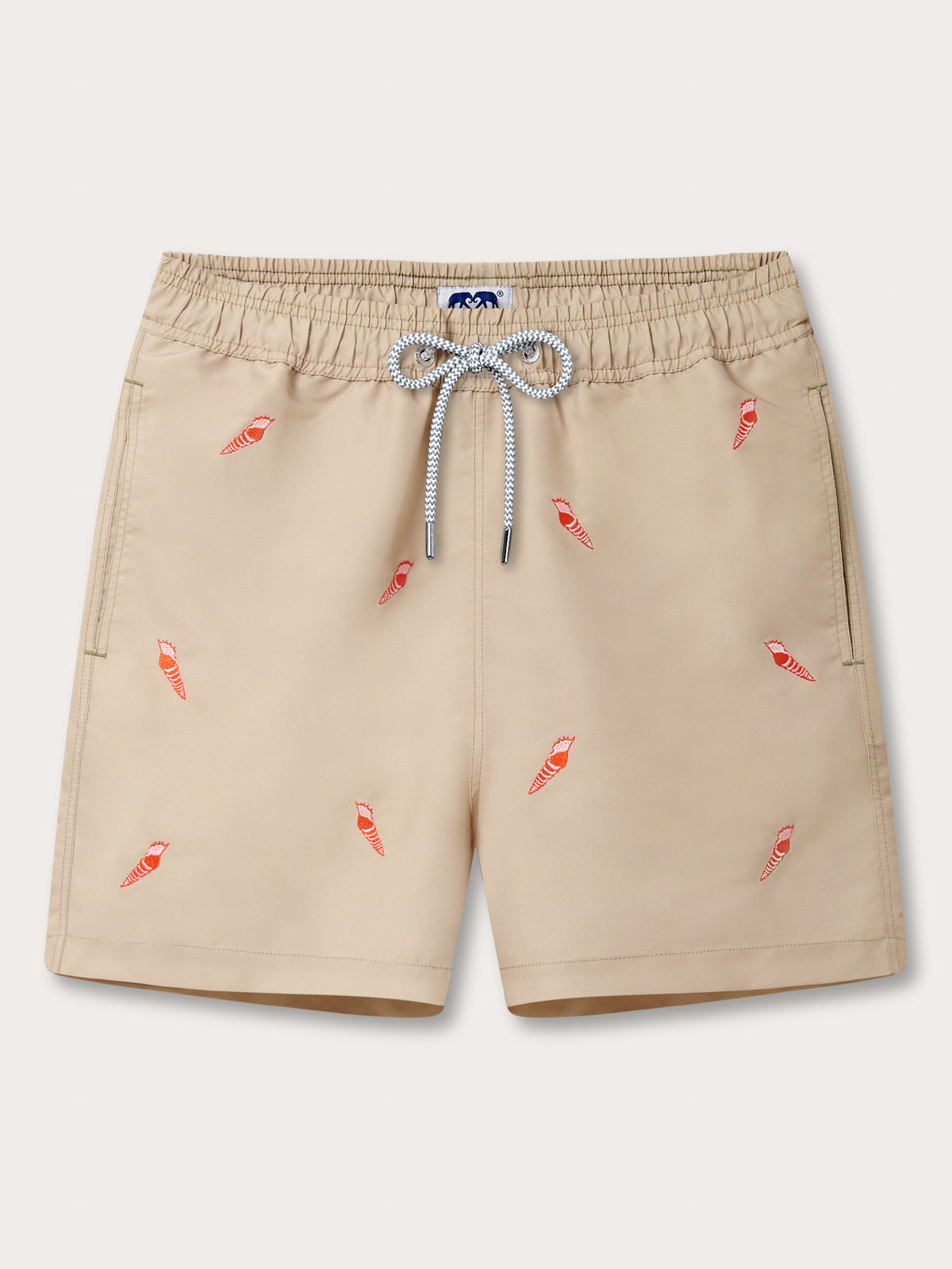 Front view of Men’s Shellebration Embroidered Staniel Swim Shorts. Beige swimming shorts with red embroidered conch shells.